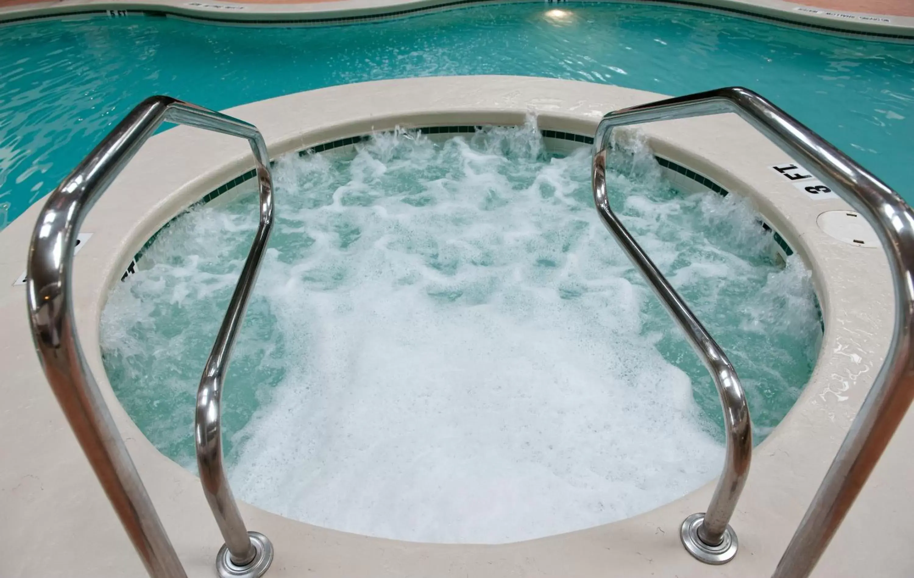 Hot Tub, Swimming Pool in Ramada by Wyndham State College Hotel & Conference Center