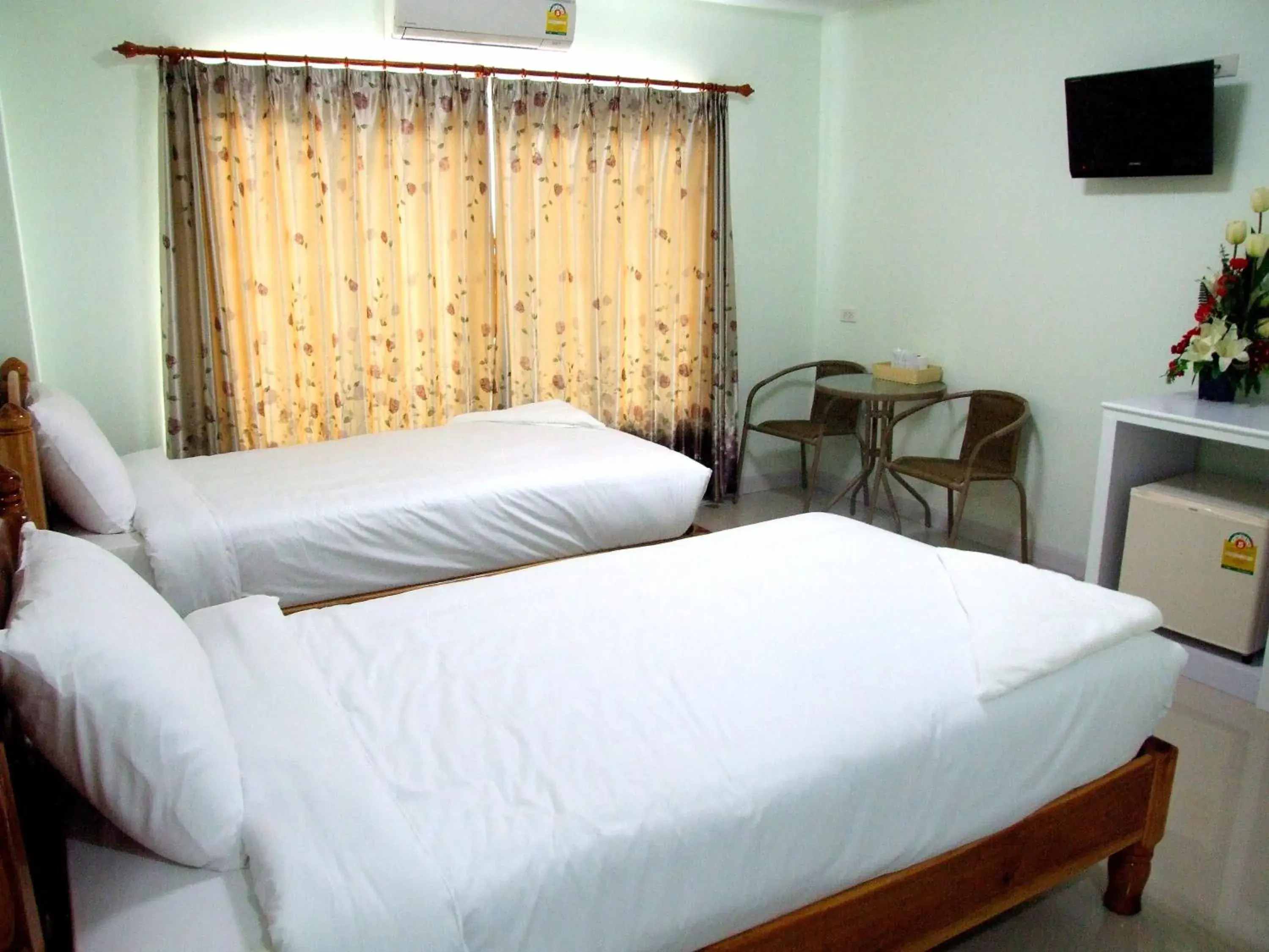 Bed in Rueanrimnam Hotel