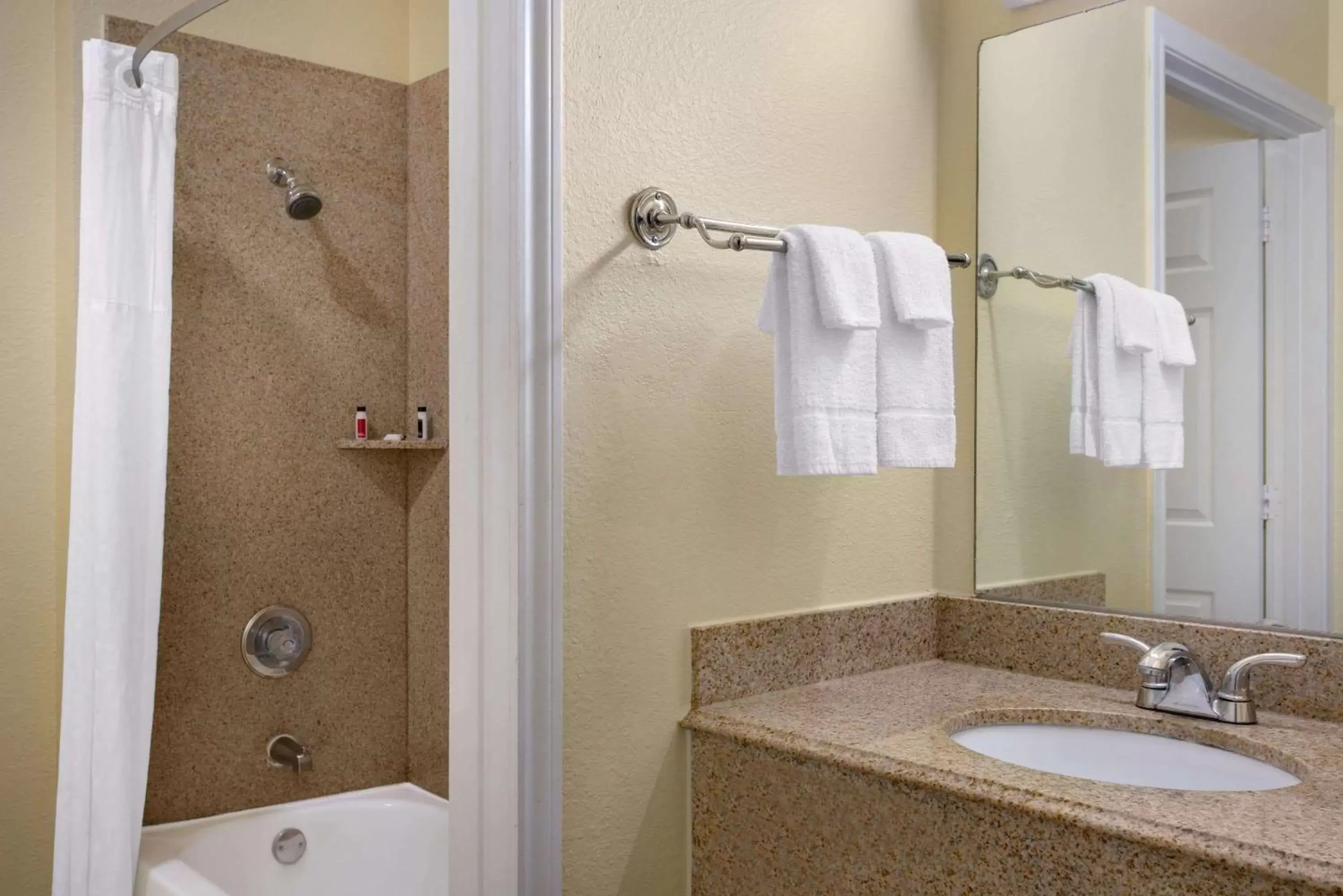 Bathroom in Days Inn & Suites by Wyndham DFW Airport South-Euless