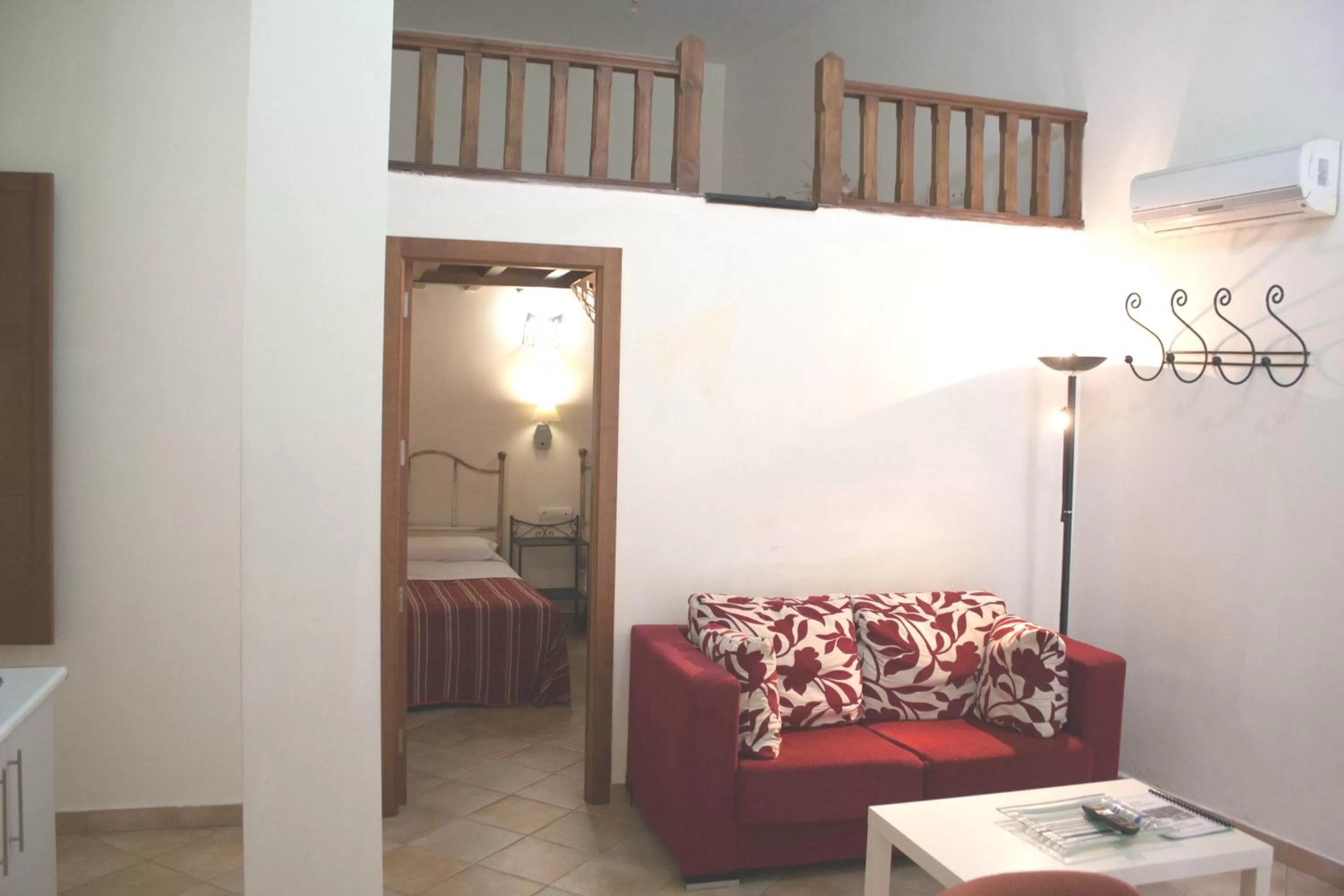 Seating area, Bed in Abadia Suites