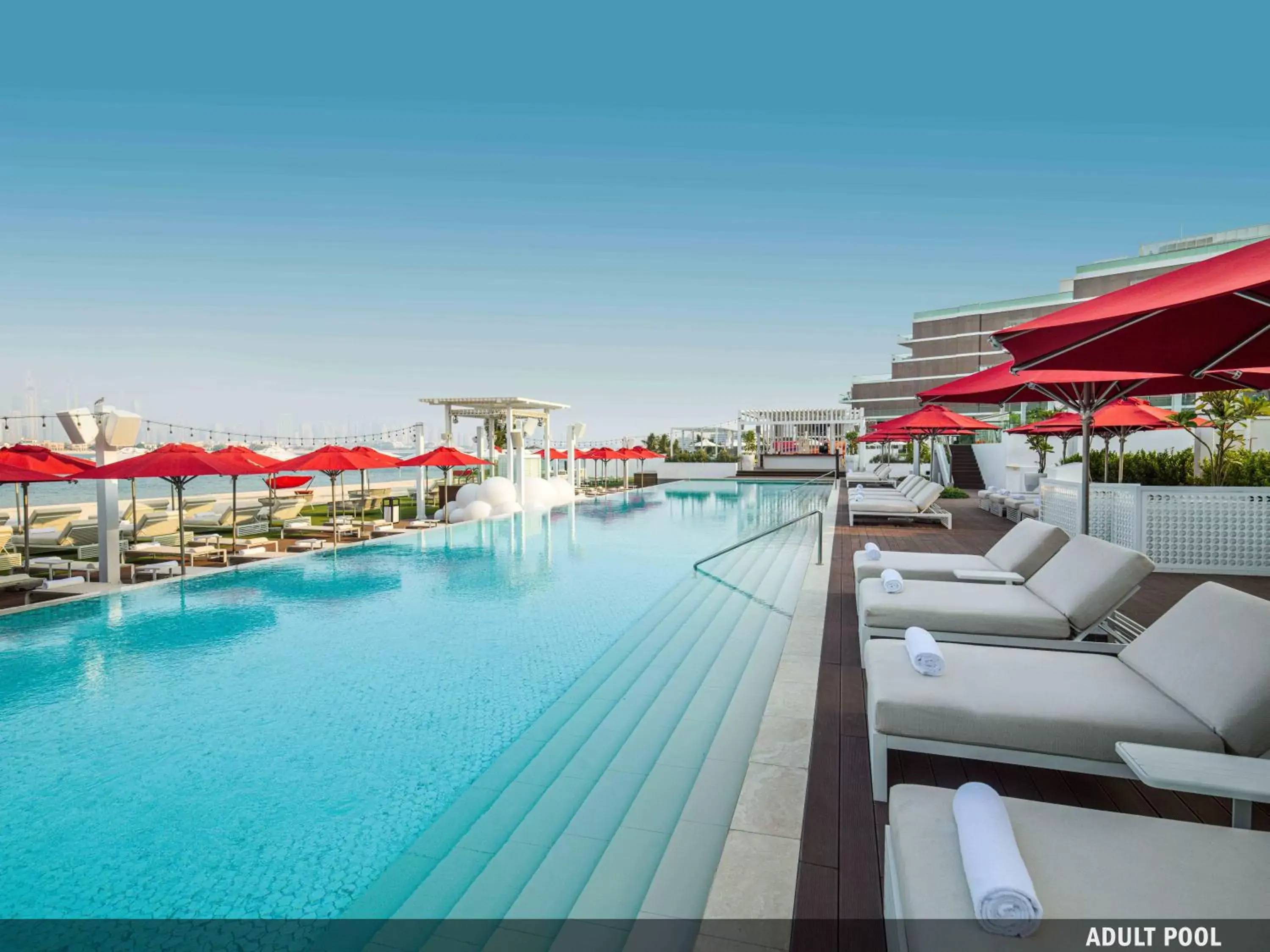 Swimming pool in Th8 Palm Dubai Beach Resort Vignette Collection, an IHG hotel Swimming pool in Th8 Palm Dubai Beach Resort Vignette Collection, an IHG hotel