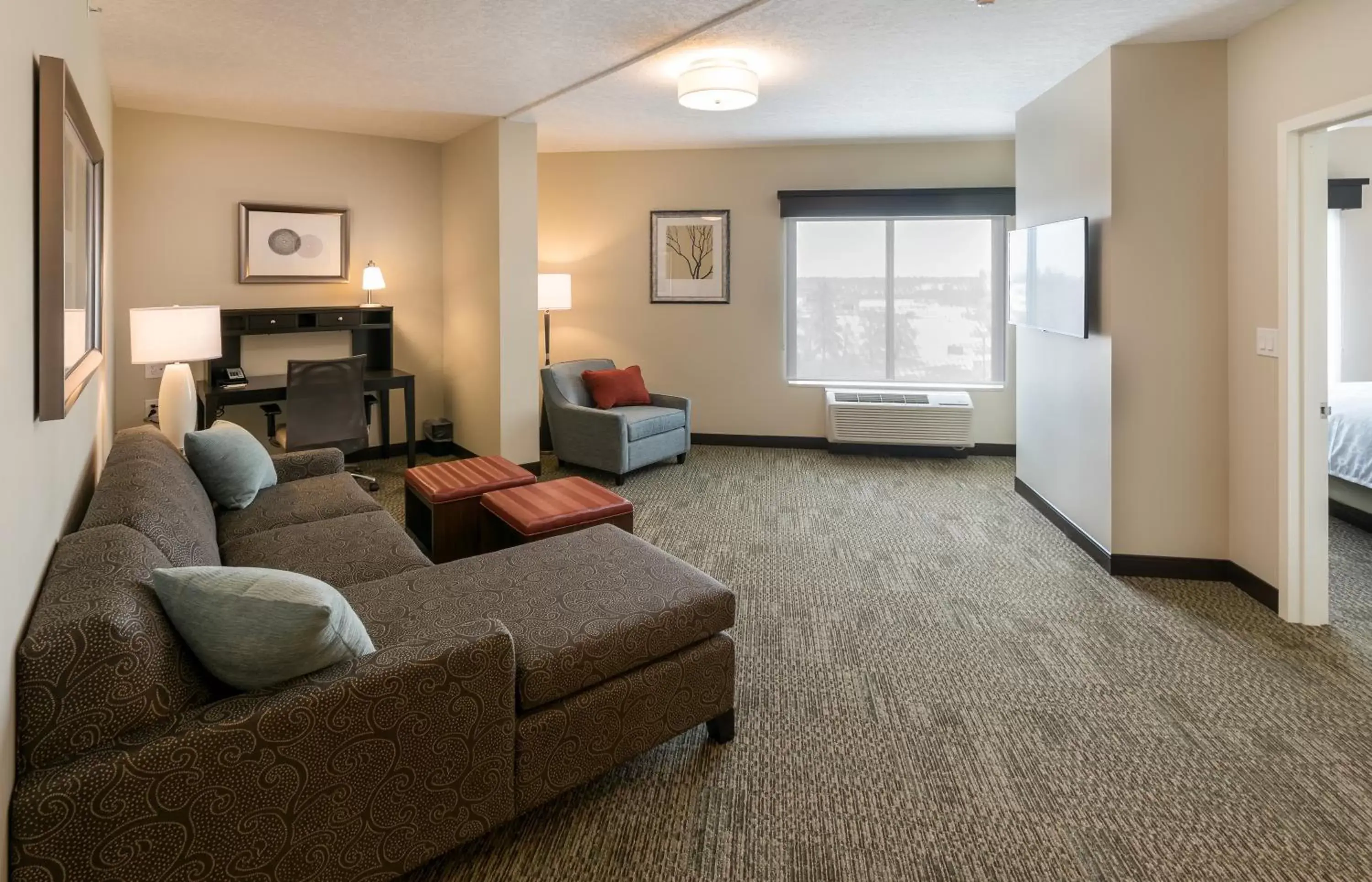 Photo of the whole room, Seating Area in Staybridge Suites - Saskatoon - University, an IHG Hotel