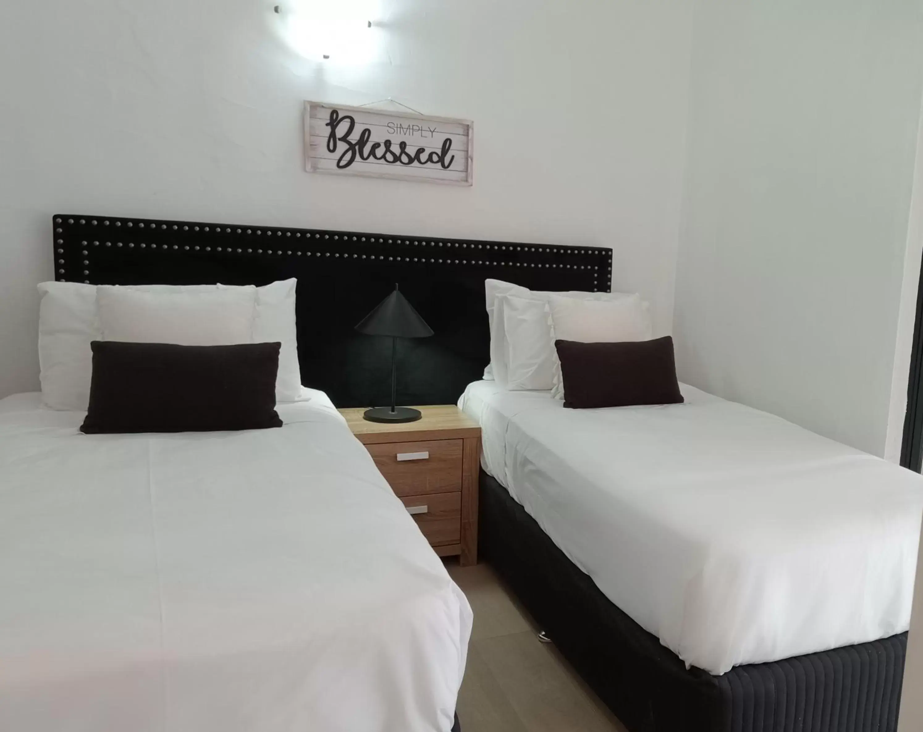 Bed in Club Tropical Resort with Onsite Reception & Check In