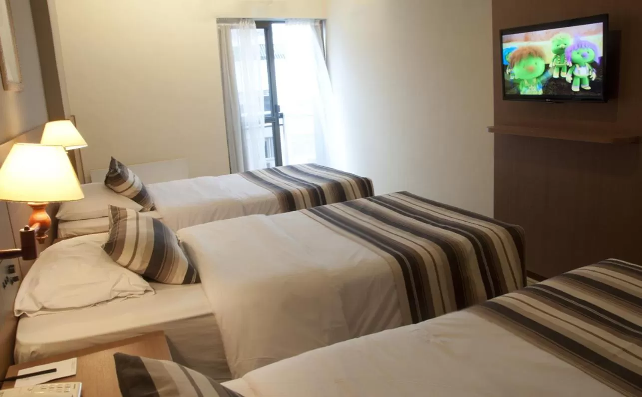 Bed in Augusto's Copacabana Hotel