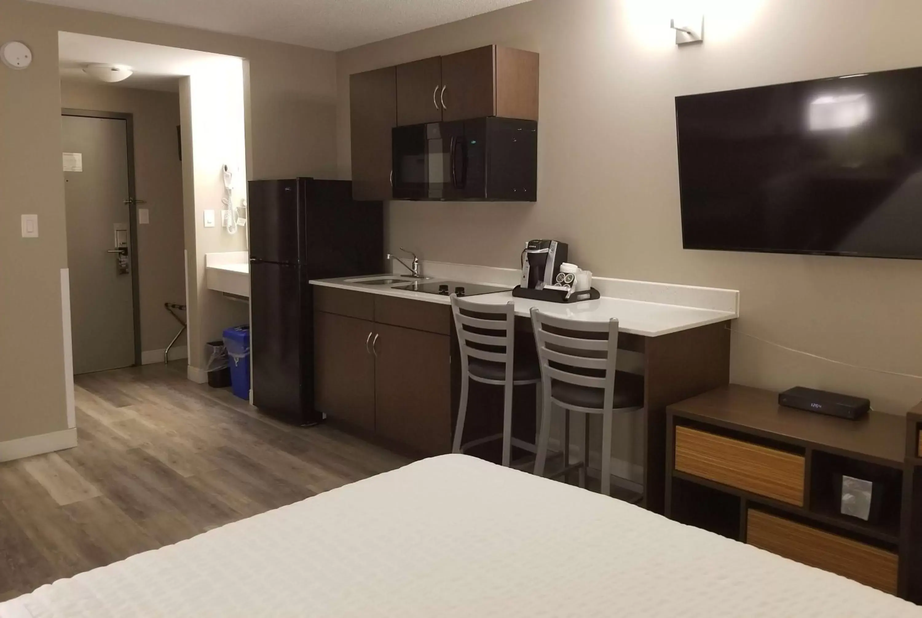 Photo of the whole room, TV/Entertainment Center in Super 8 by Wyndham Winnipeg West