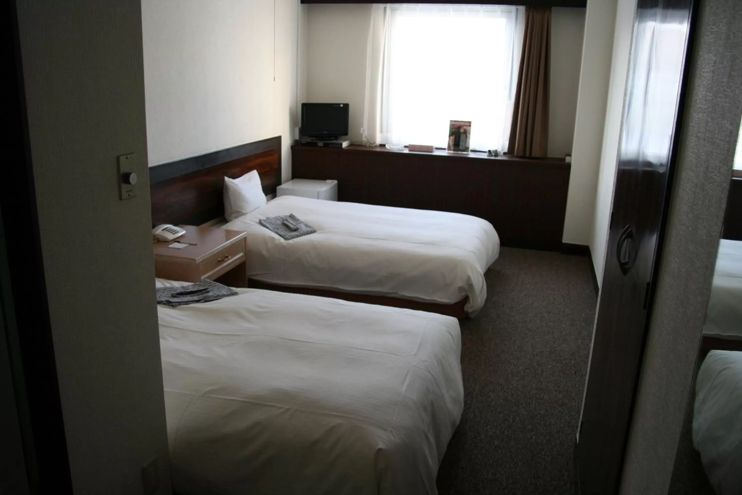 Bed in Tabist Hotel Tetora Hakodate Station