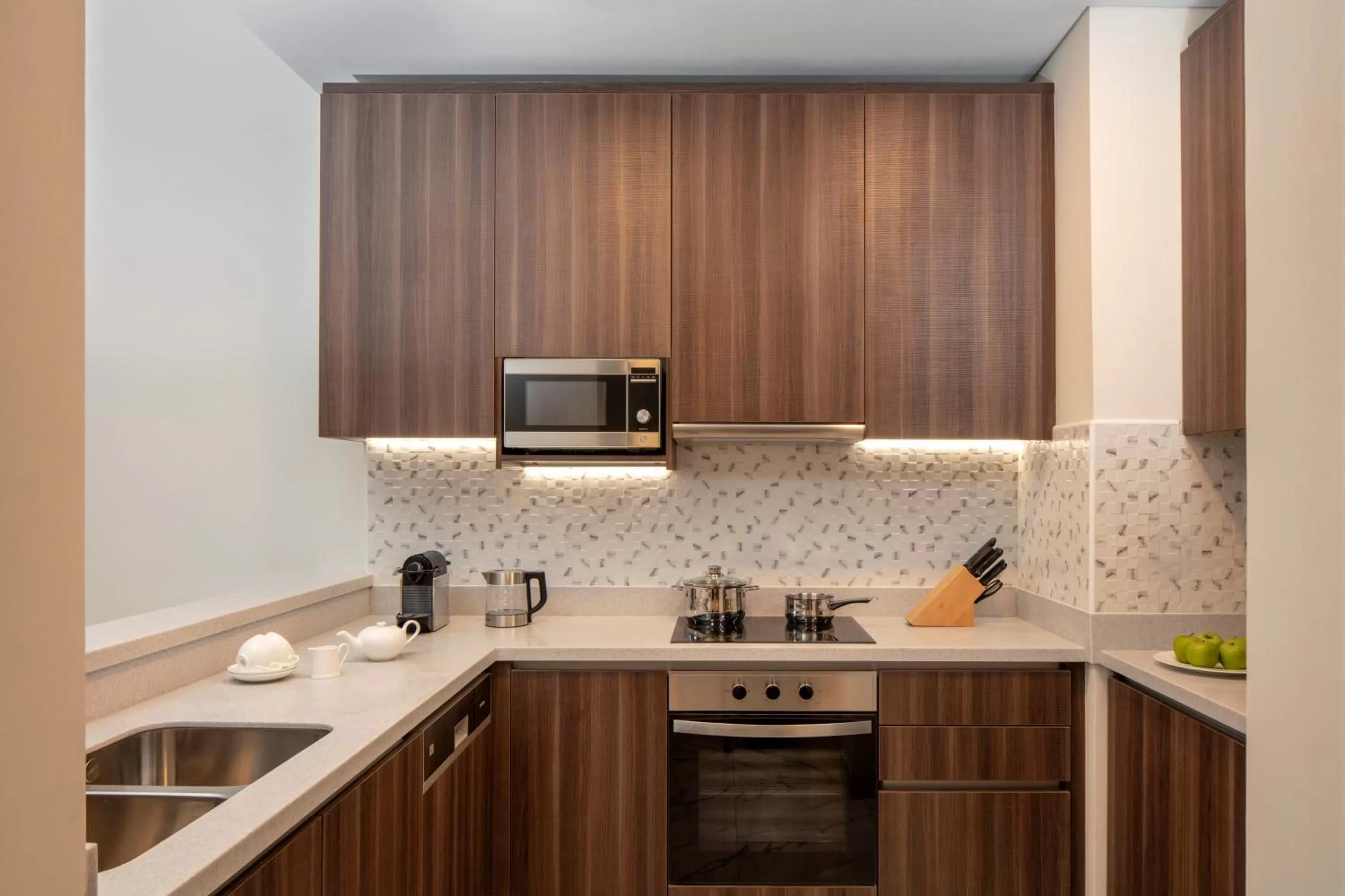 Kitchen or kitchenette in Avani Plus Palm View Dubai Hotel & Suites