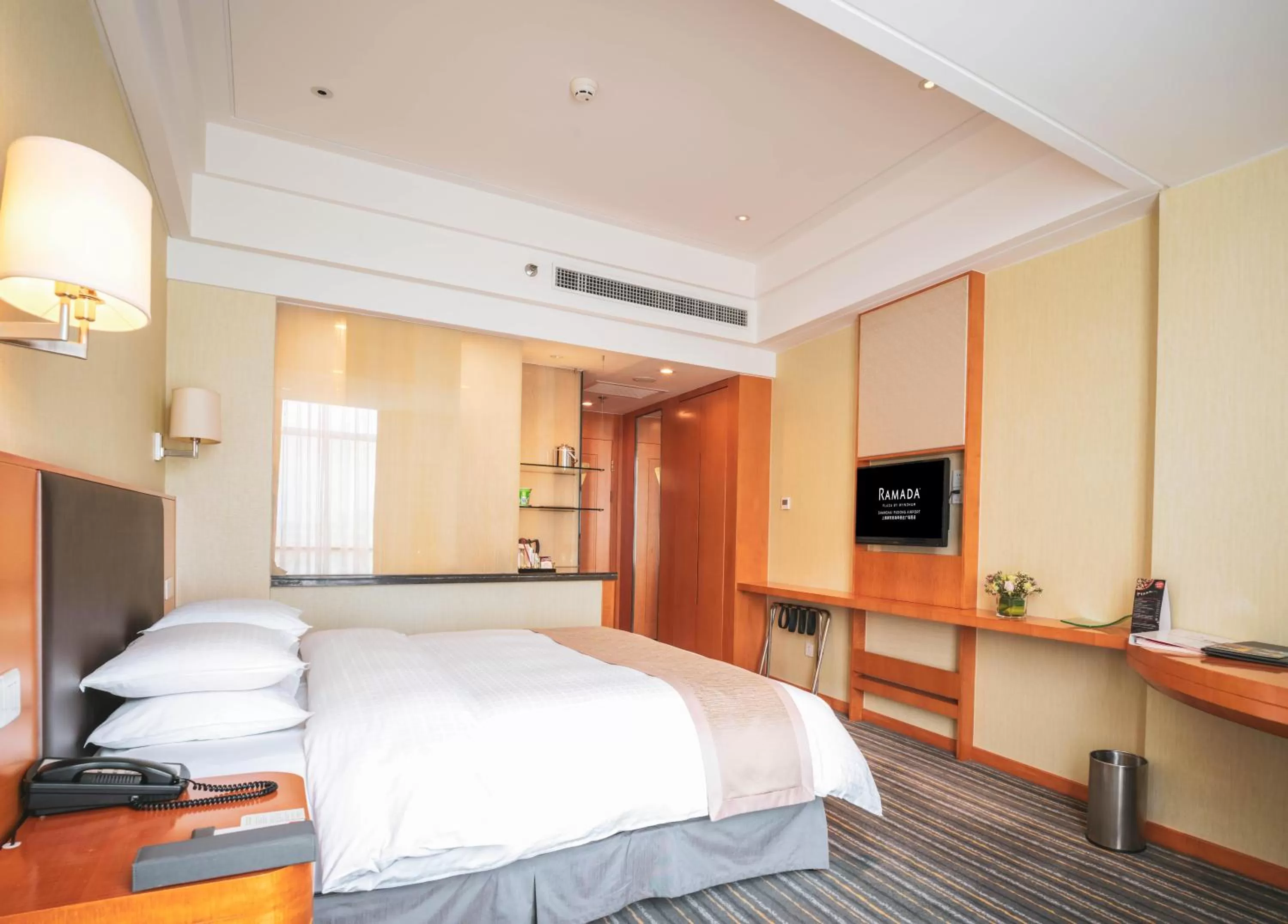 Bed in Ramada Plaza Shanghai Pudong Airport - 3 mins to PVG depature floor & check entrance with hotel shuttle