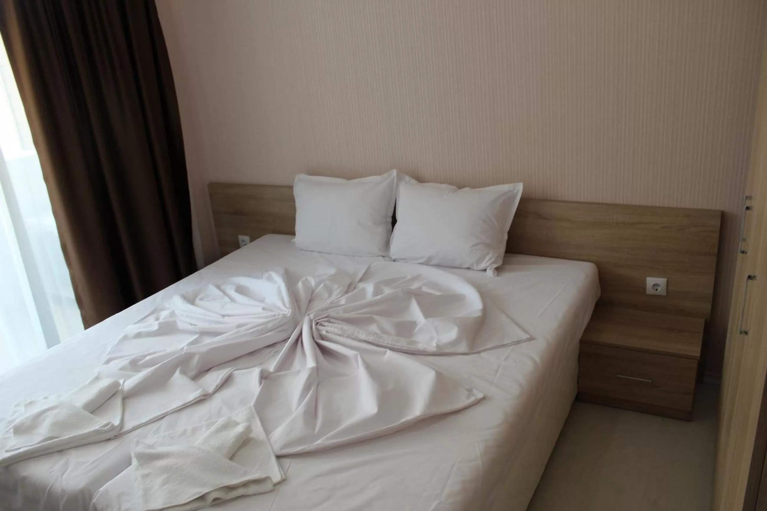 Bed in APART-HOTEL Stamopolu Lux с изглед към морето