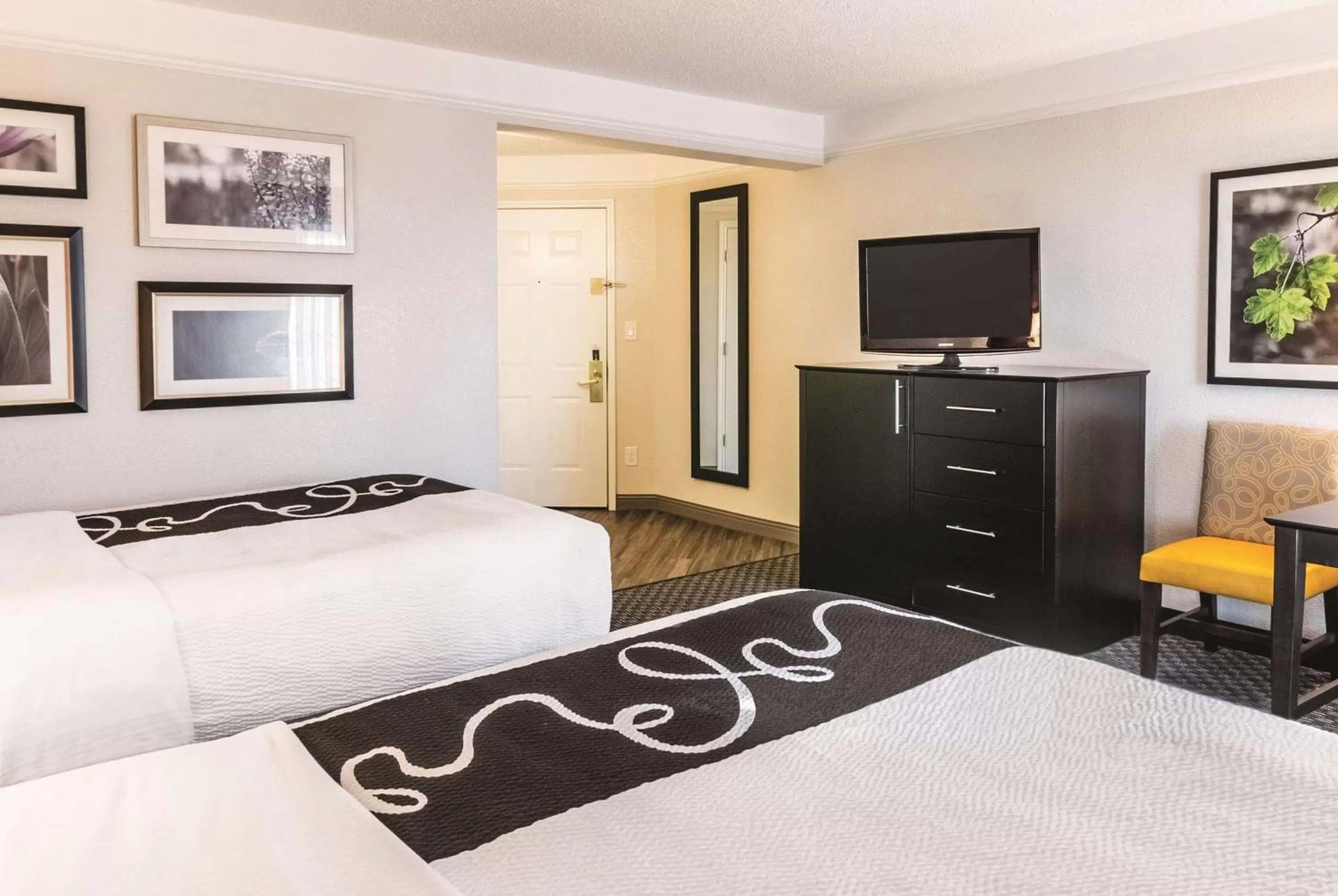 Photo of the whole room, Bed in La Quinta by Wyndham Orlando Airport North - Free Airport Shuttle!