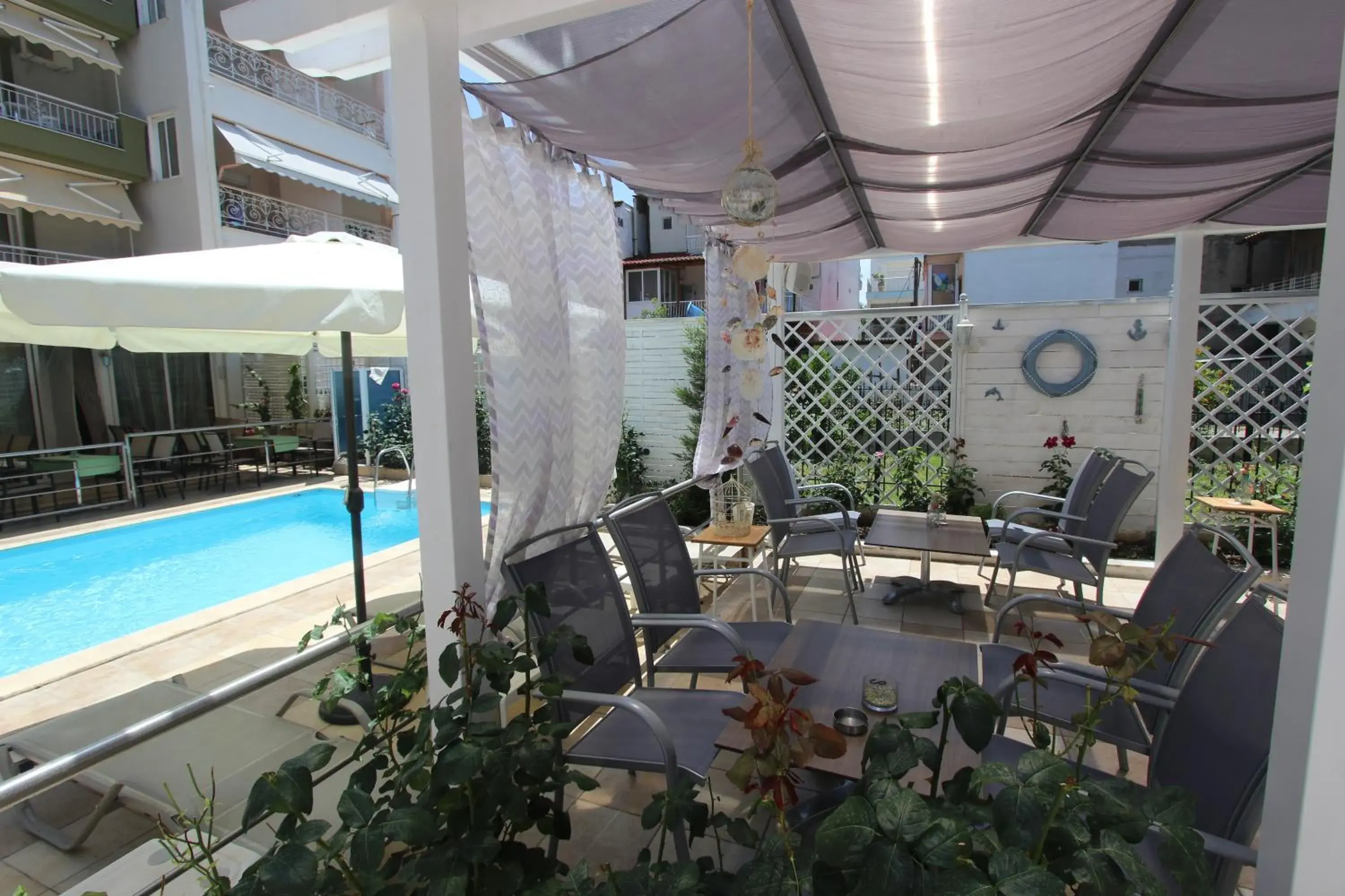Patio, Swimming Pool in Hotel Mallas