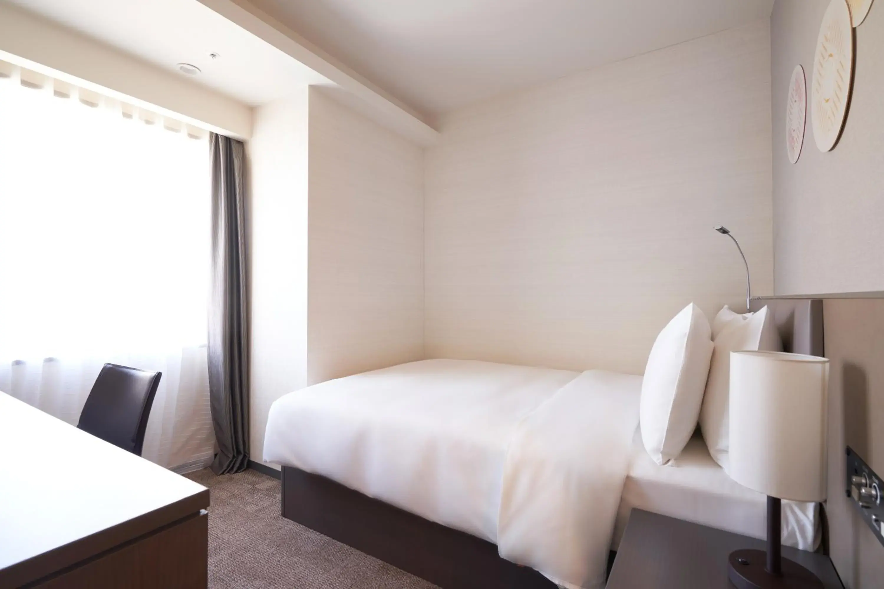 Bed in Holiday Inn & Suites Shin Osaka, an IHG Hotel