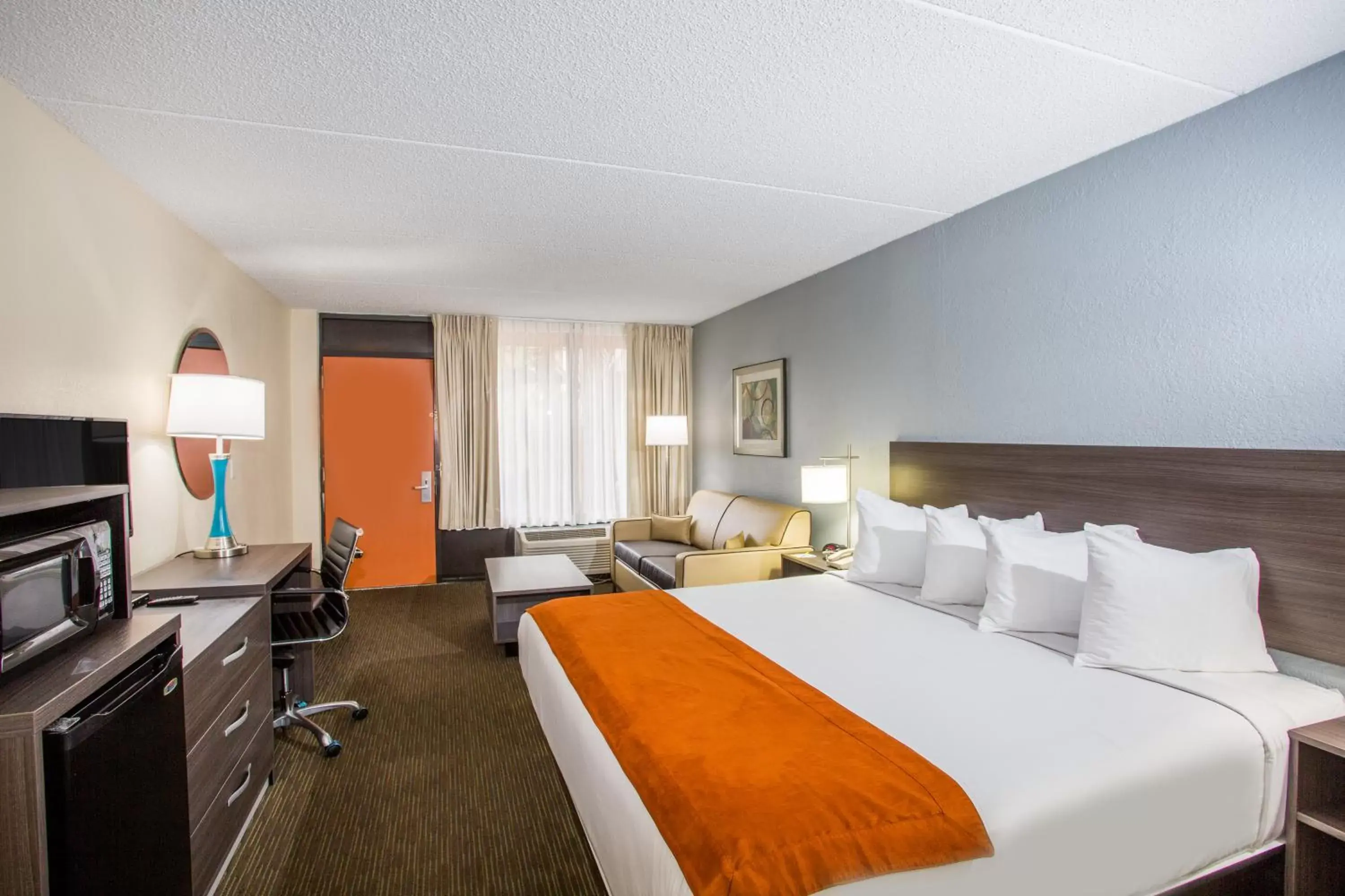 Photo of the whole room in Days Inn & Suites by Wyndham Orlando Airport