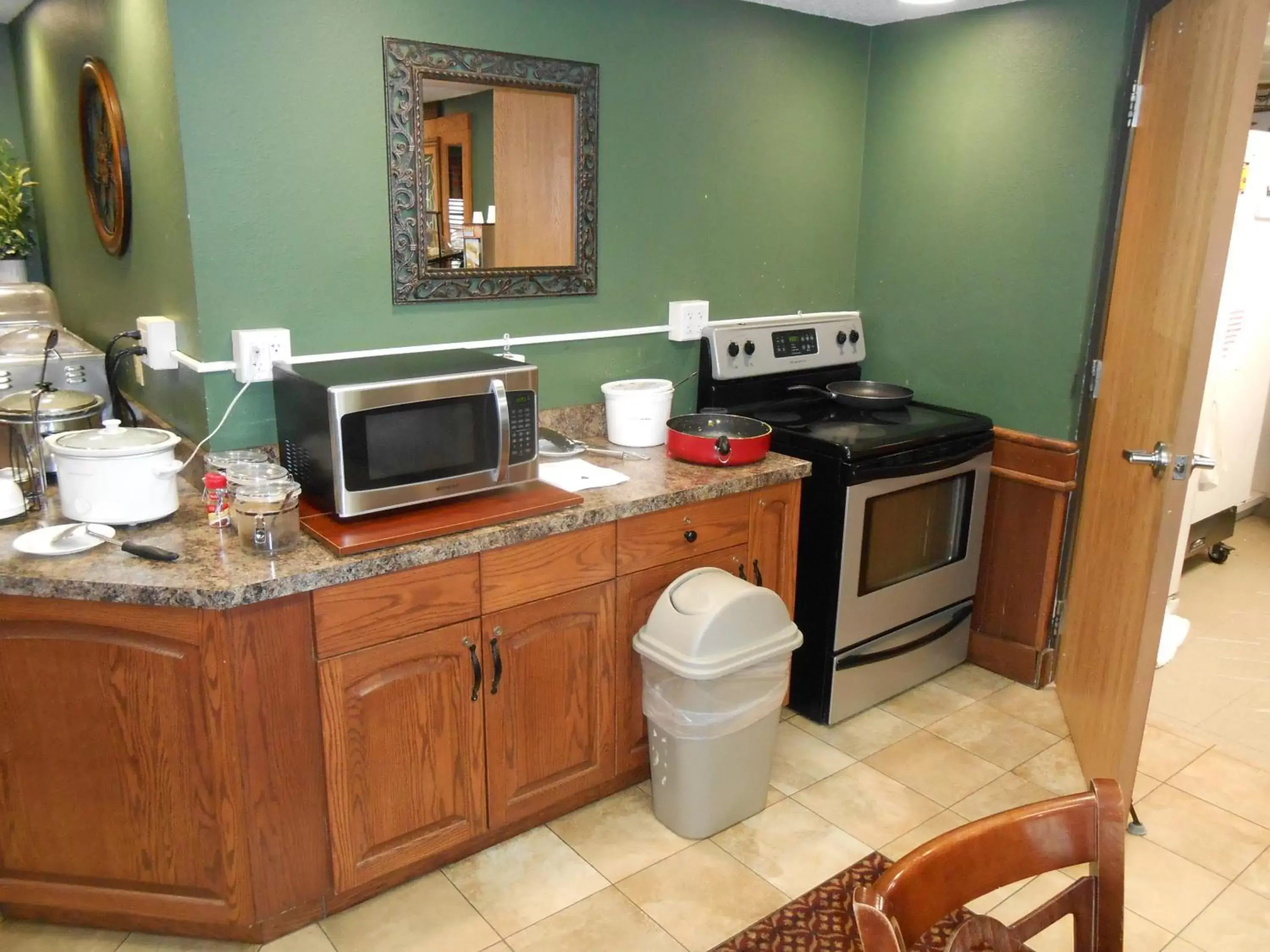 Kitchen or kitchenette, Kitchen/Kitchenette in AmericInn by Wyndham McAlester