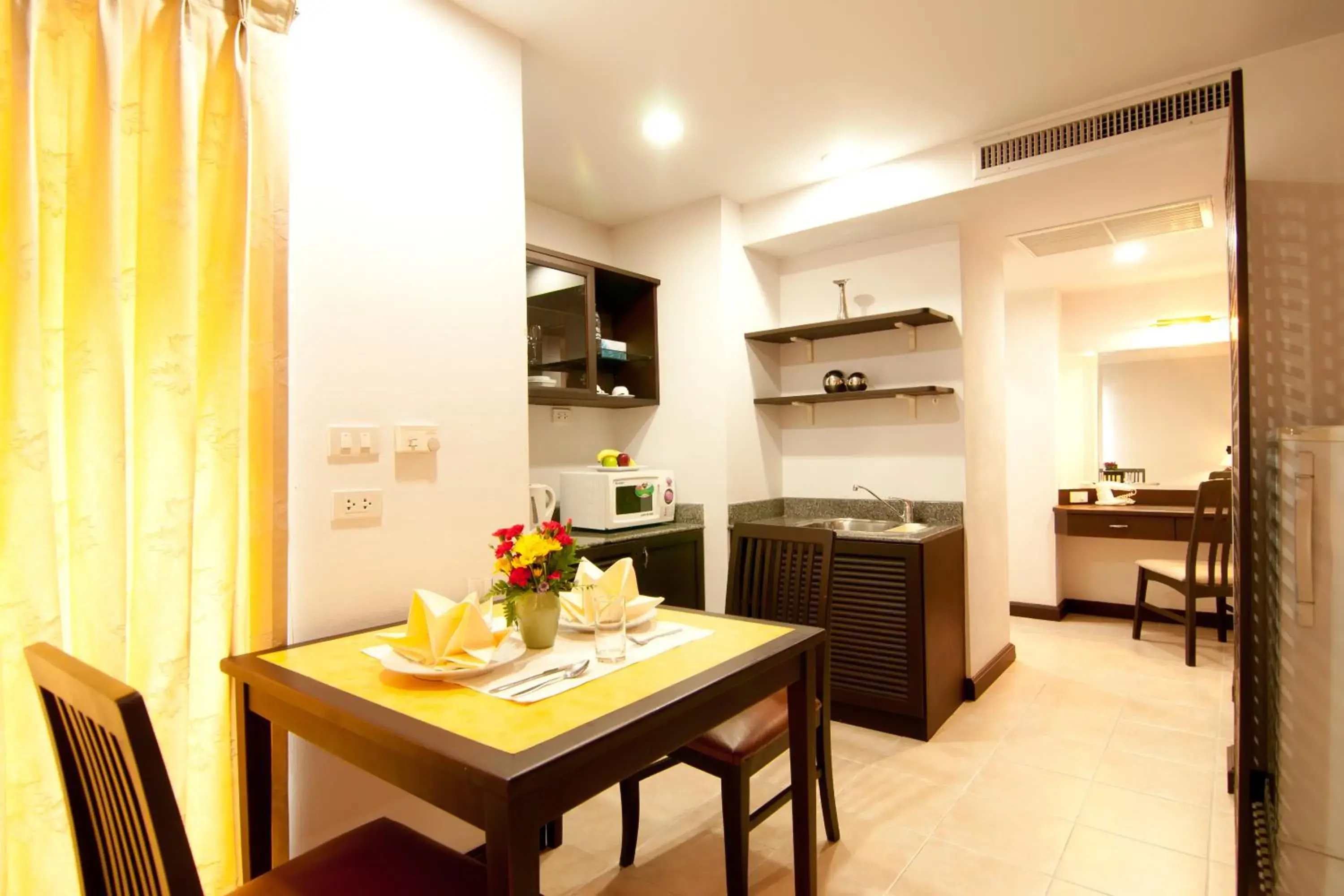 Kitchen or kitchenette, Dining Area in The Patra Hotel - Rama 9
