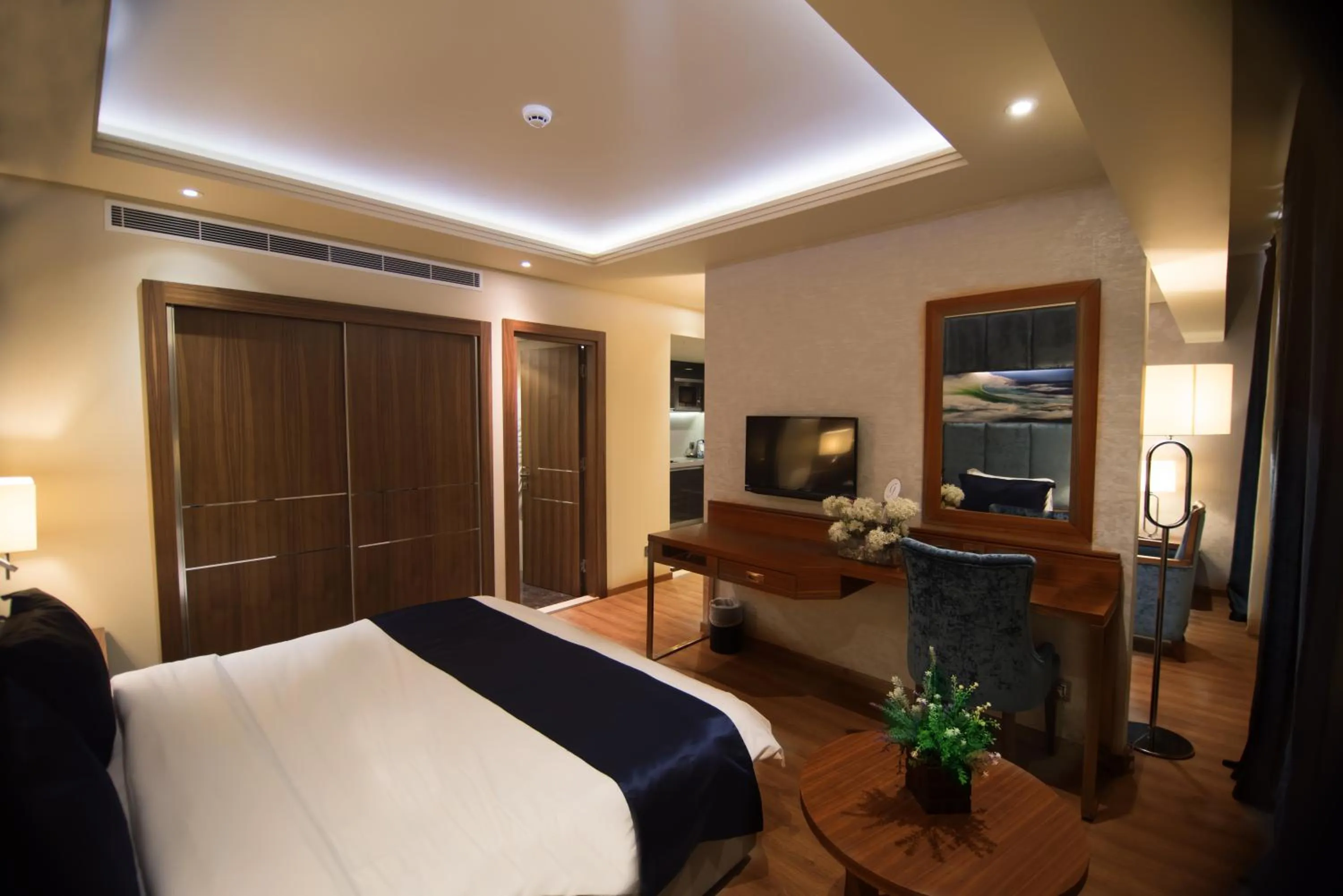 Living room, Bed in Gems Hotel