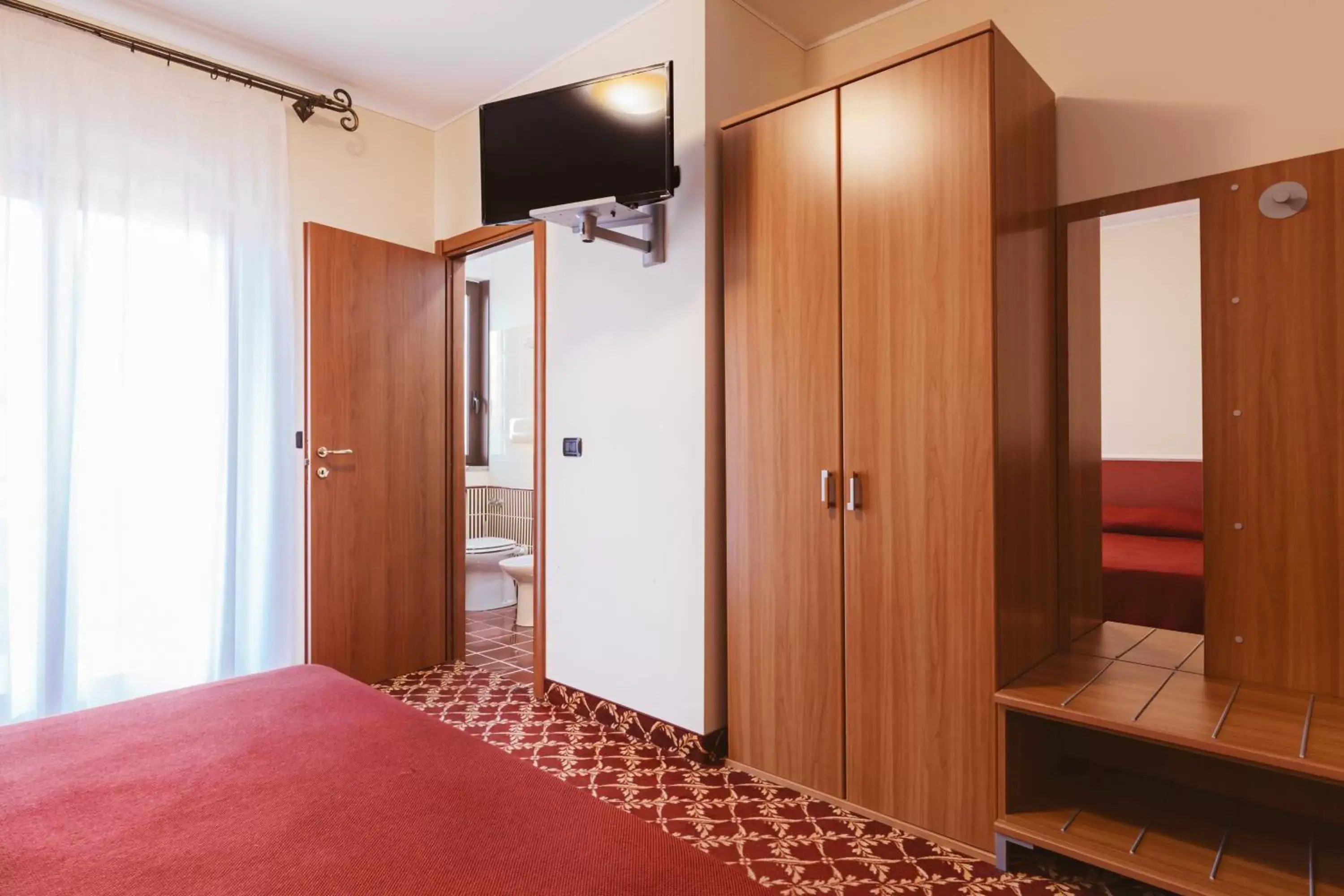 Bedroom, TV/Entertainment Center in Hotel Villa Del Sorriso