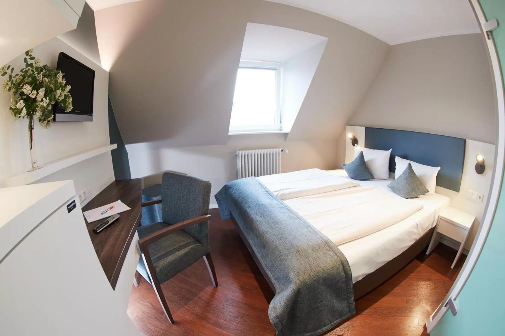 Photo of the whole room, Bed in Stadthotel Freiburg Kolping Hotels & Resorts