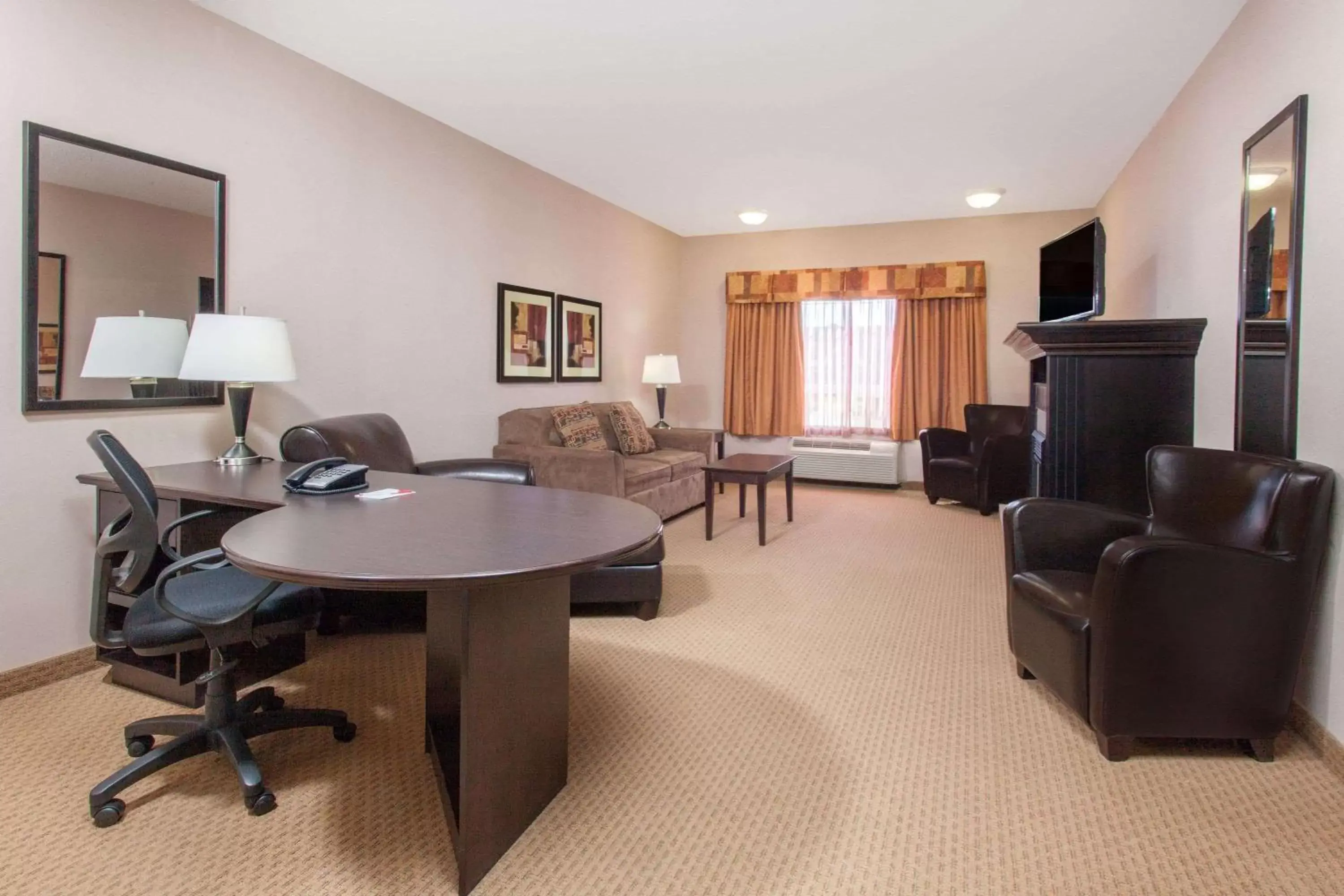 Photo of the whole room, Seating Area in Ramada by Wyndham Brooks