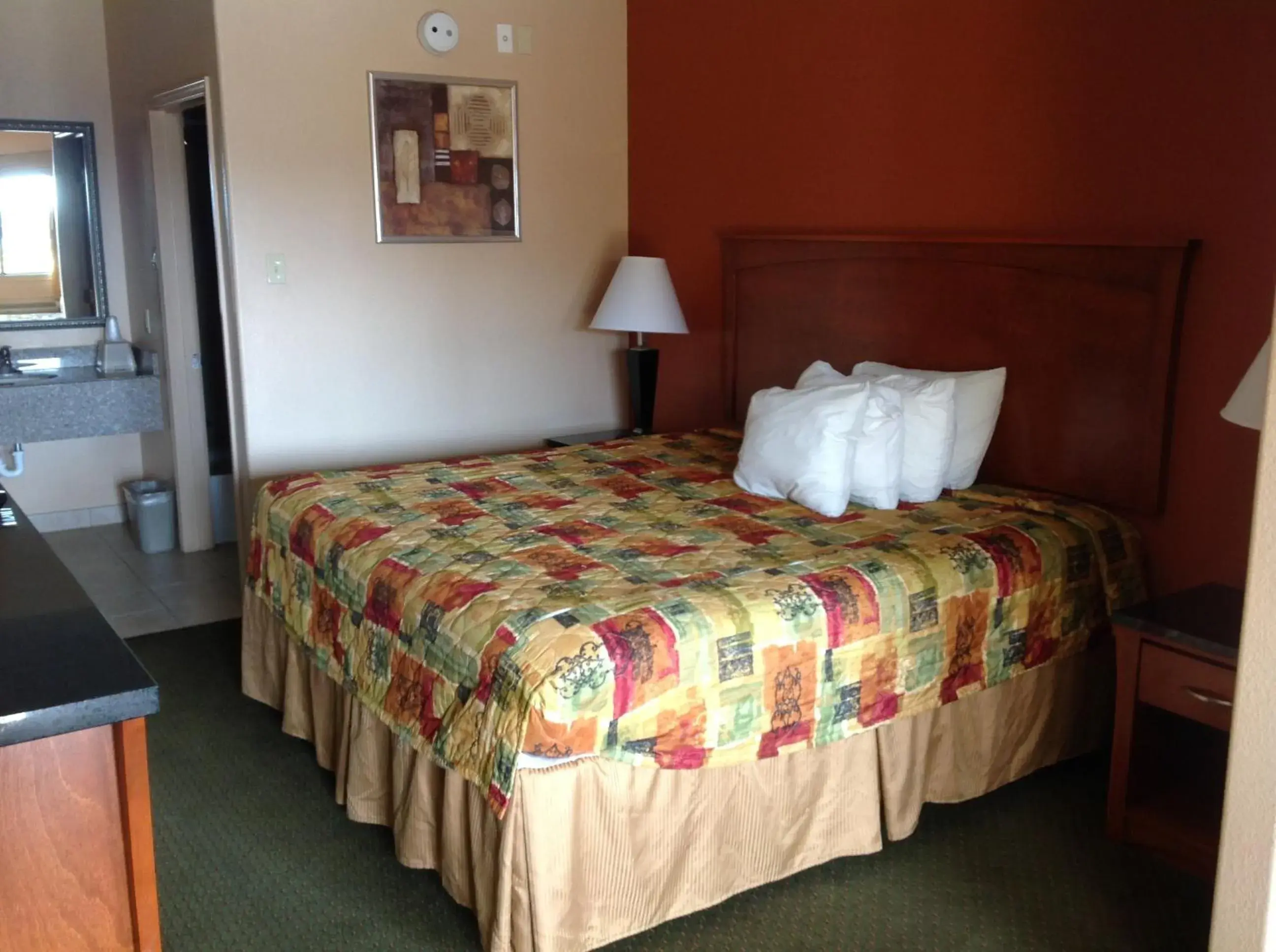 Bed in Budgetel Inn and Suites