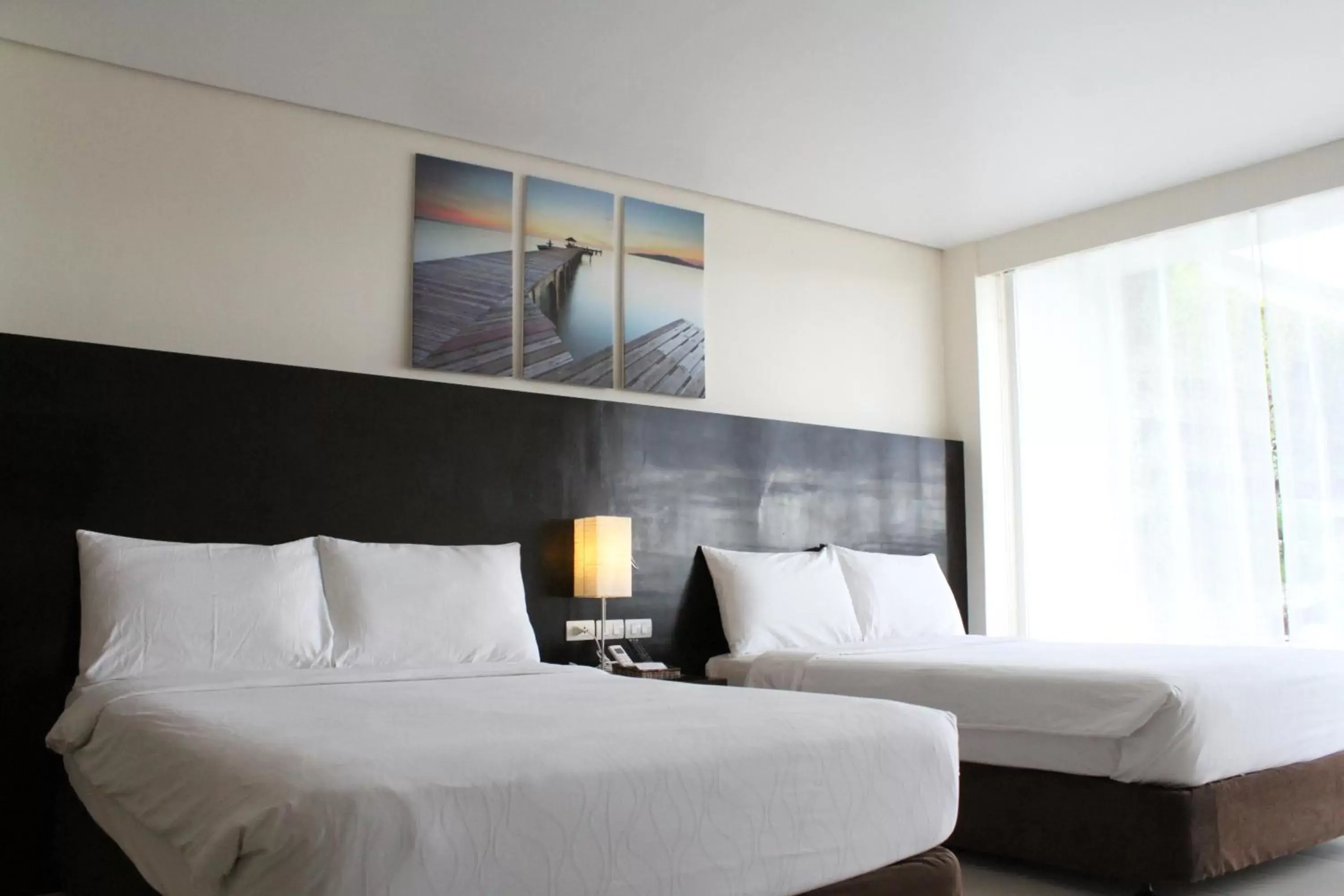Bed in Ocean Suites Bohol Boutique Hotel