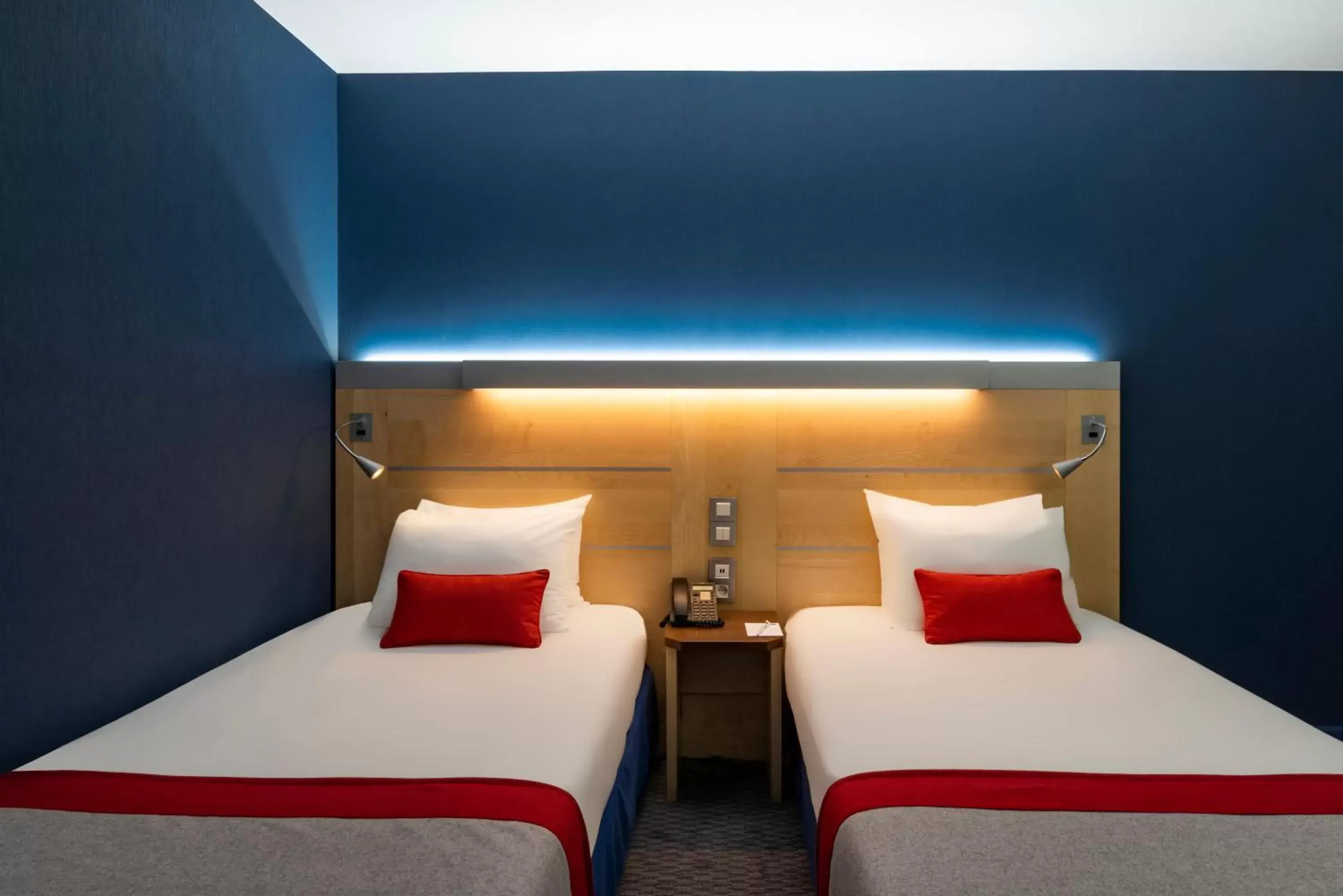 Bed in Holiday Inn Express Paris-Canal De La Villette, an IHG Hotel