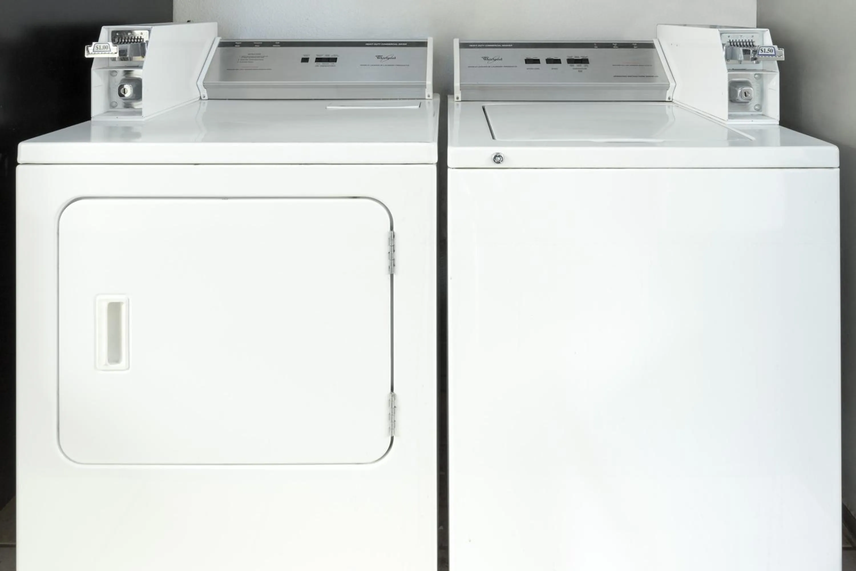 washing machine in Super 8 by Wyndham Dewitt