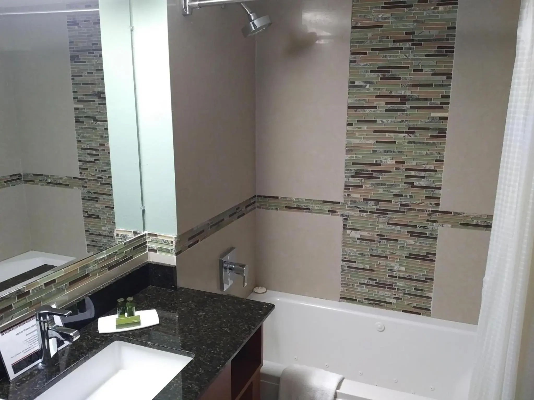 Bathroom in Marble Waters Hotel & Suites, Trademark by Wyndham