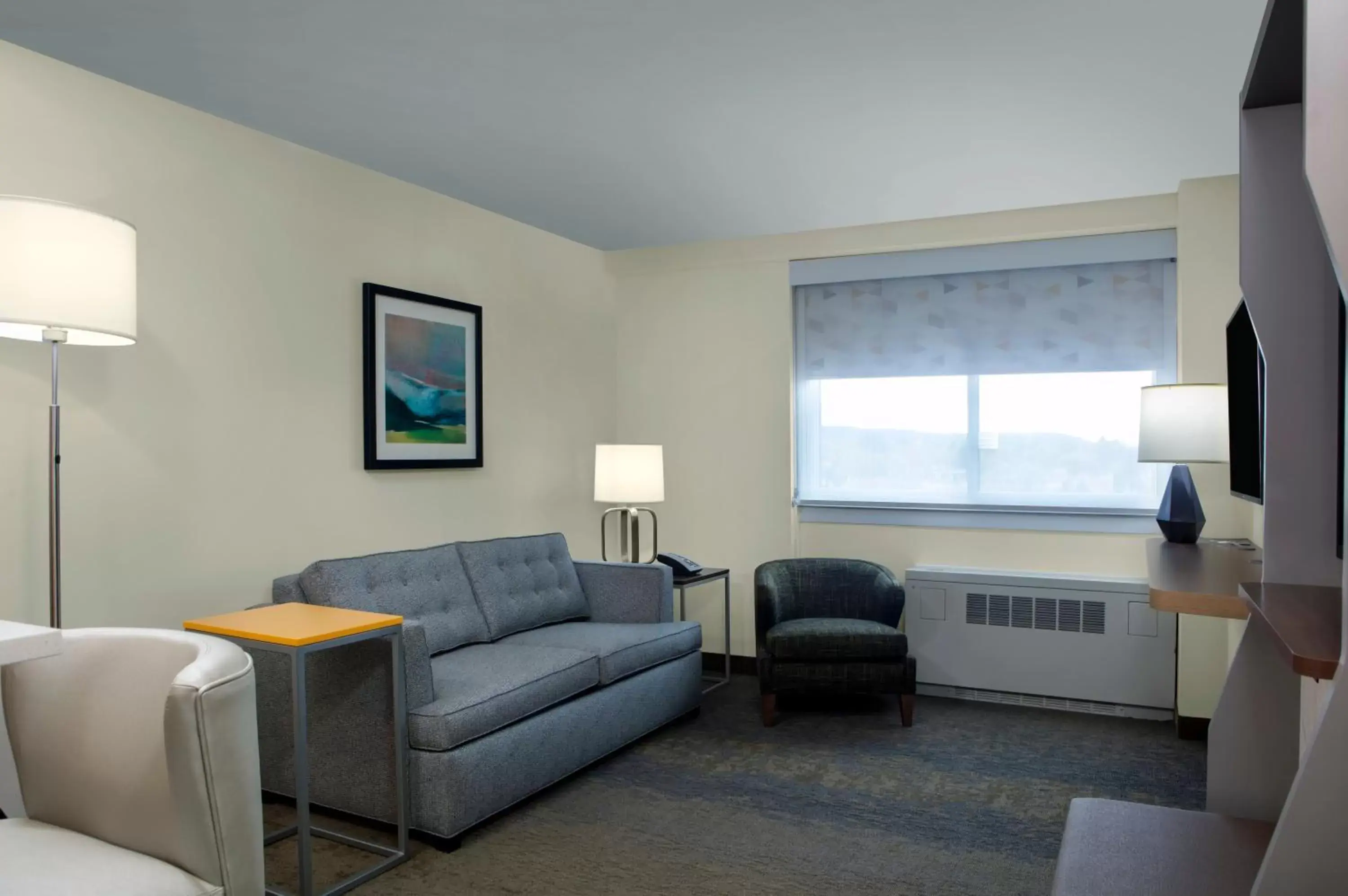 Photo of the whole room, Seating Area in Holiday Inn Binghamton-Downtown Hawley Street, an IHG Hotel
