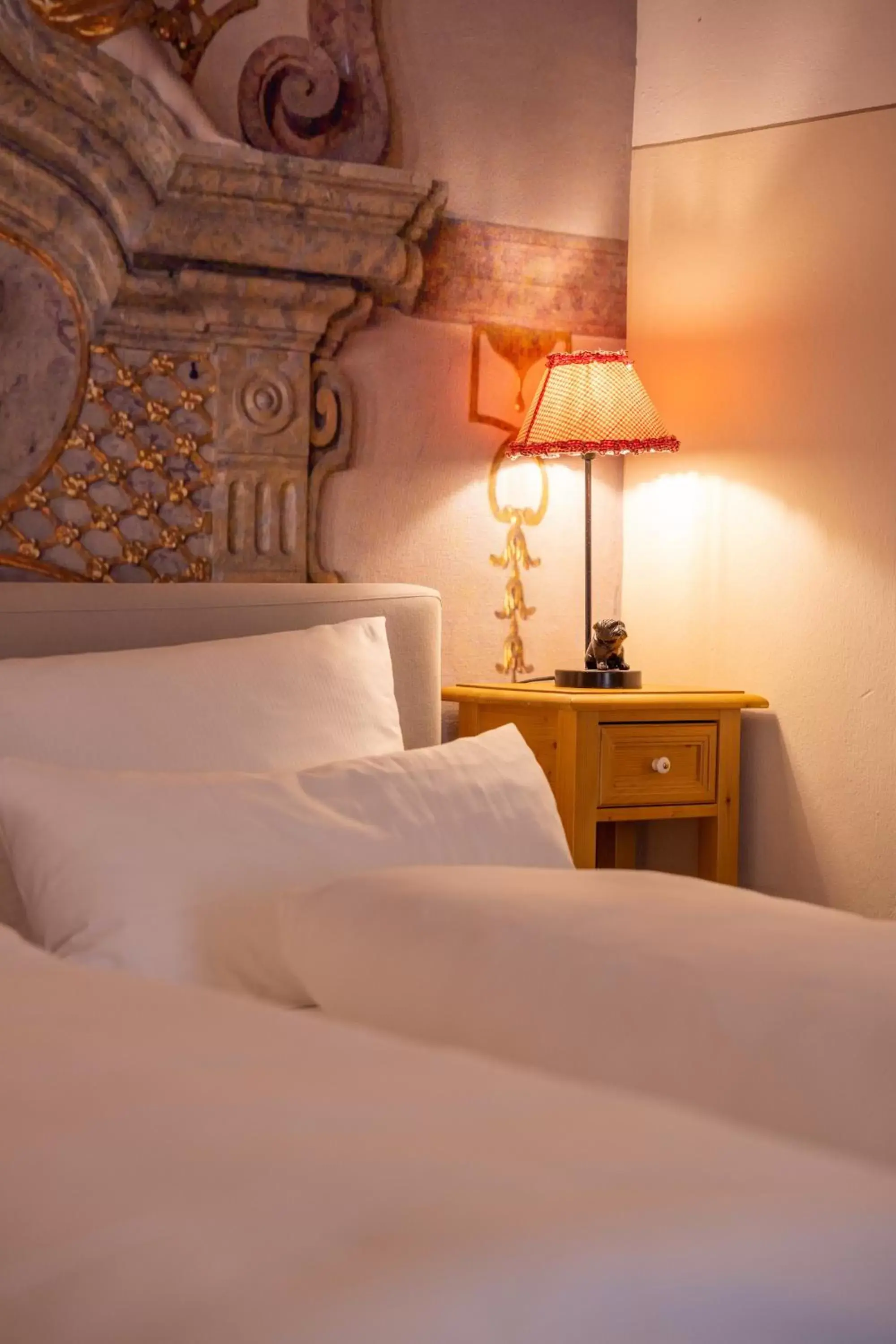 Bed in Boutiquehotel Amadeus