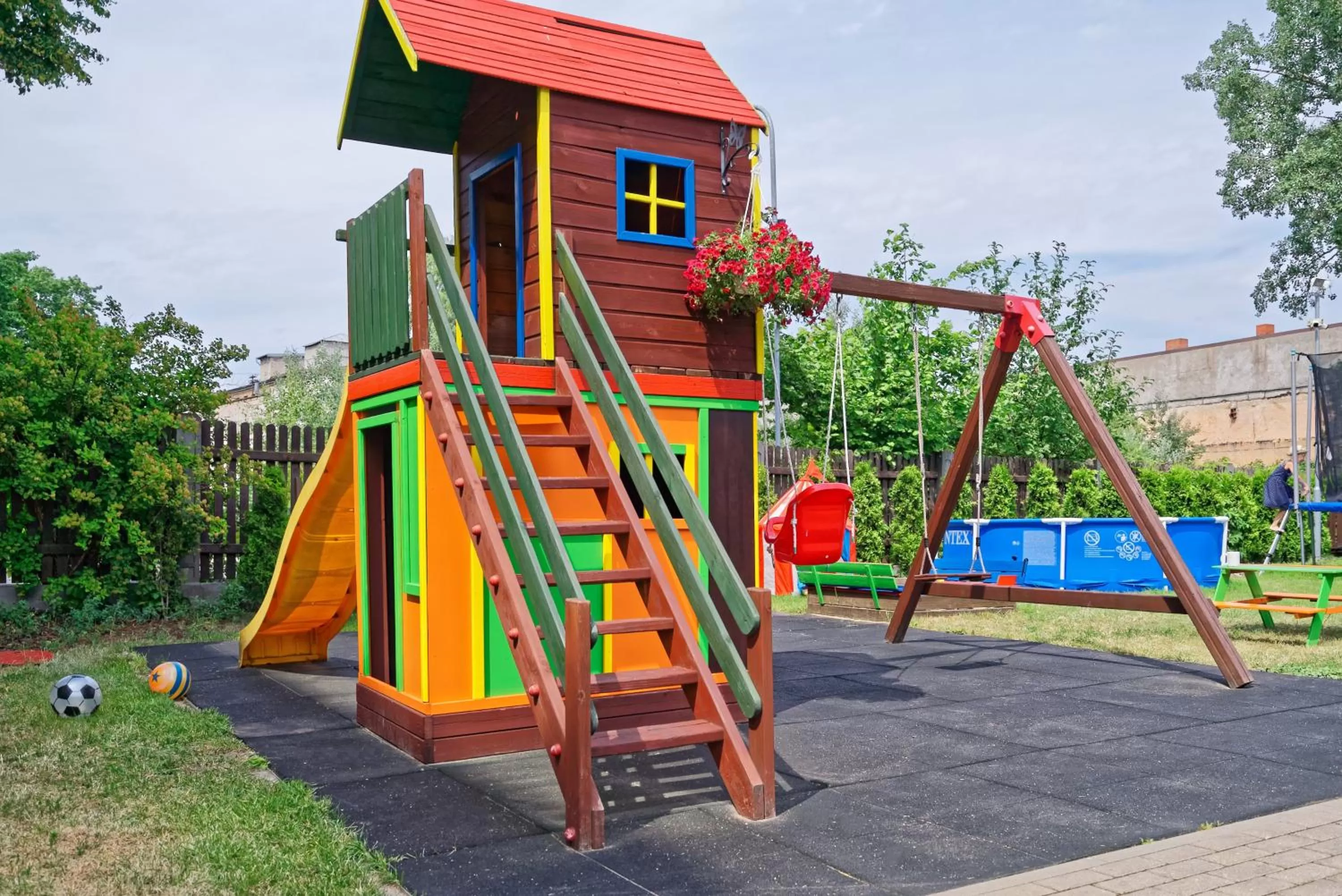 Children play ground in RIGAAPARTMENT SONADA Family Aparthotel - Private Parking