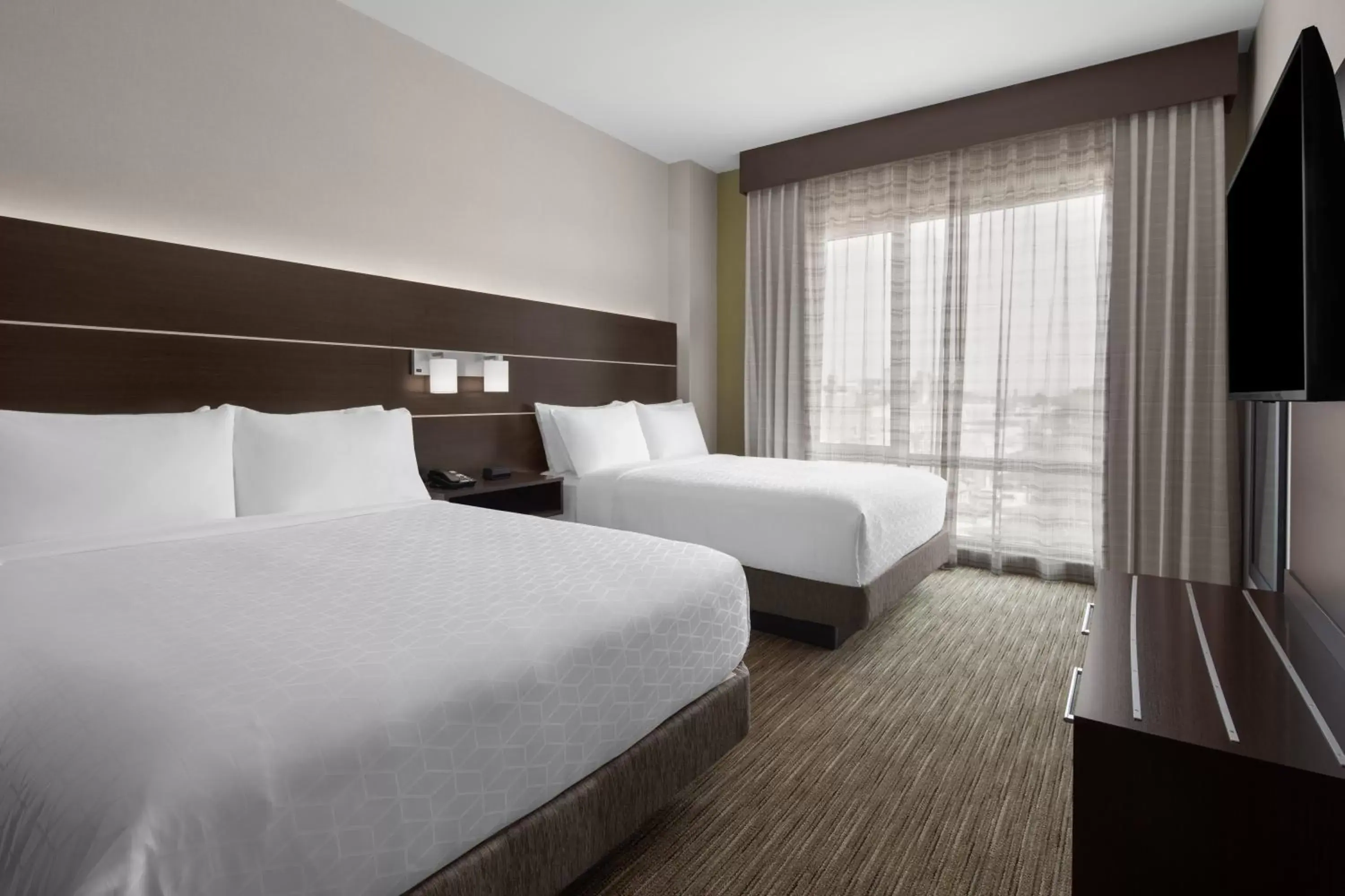 Bedroom, Bed in Holiday Inn Express & Suites - Woodside Queens NYC, an IHG Hotel