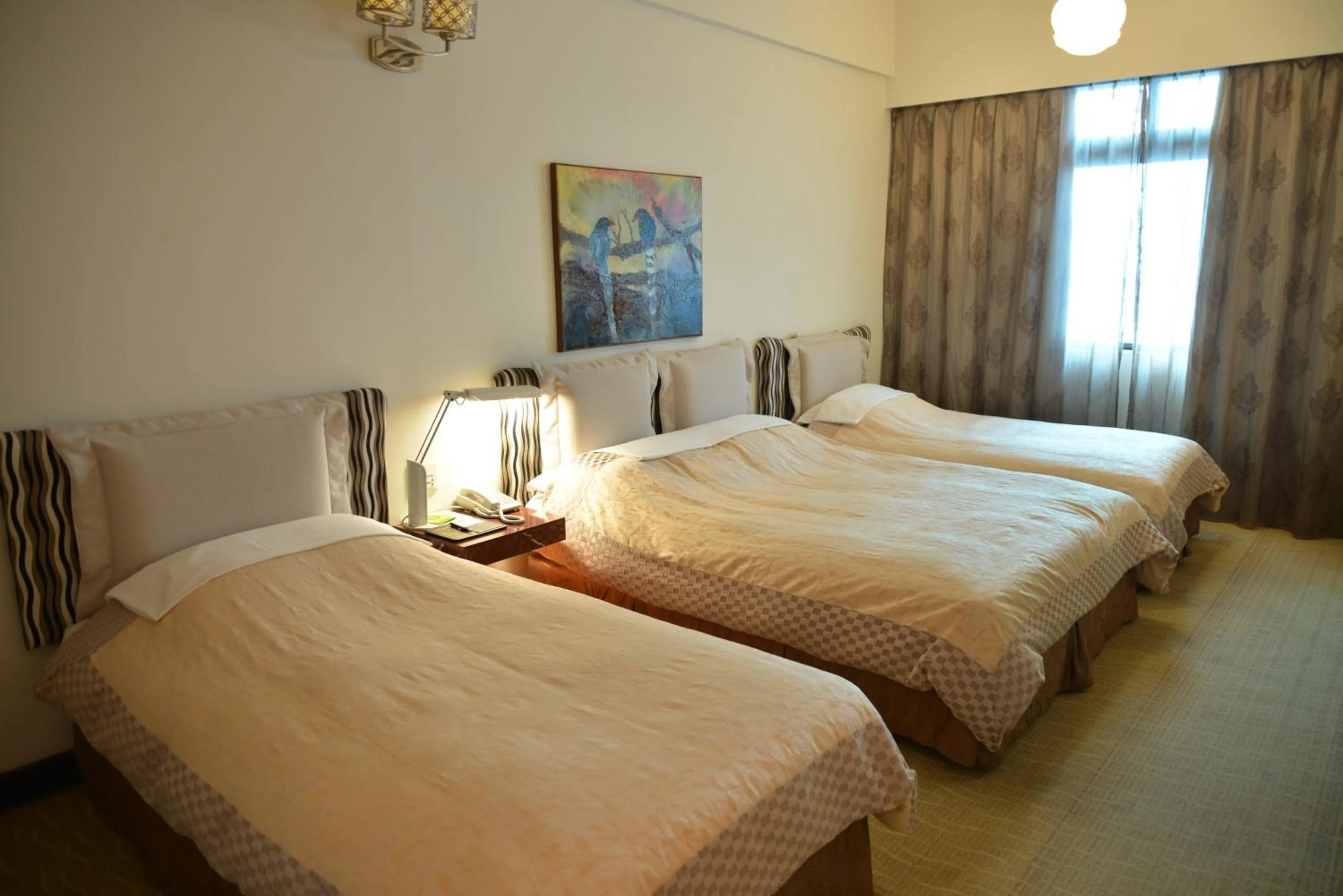 Bed in Kingship Hotel Kaohsiung Inter Continental