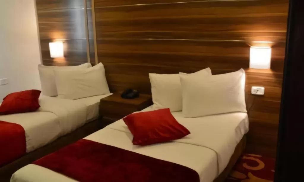 Bed in Spark Plaza Hotel