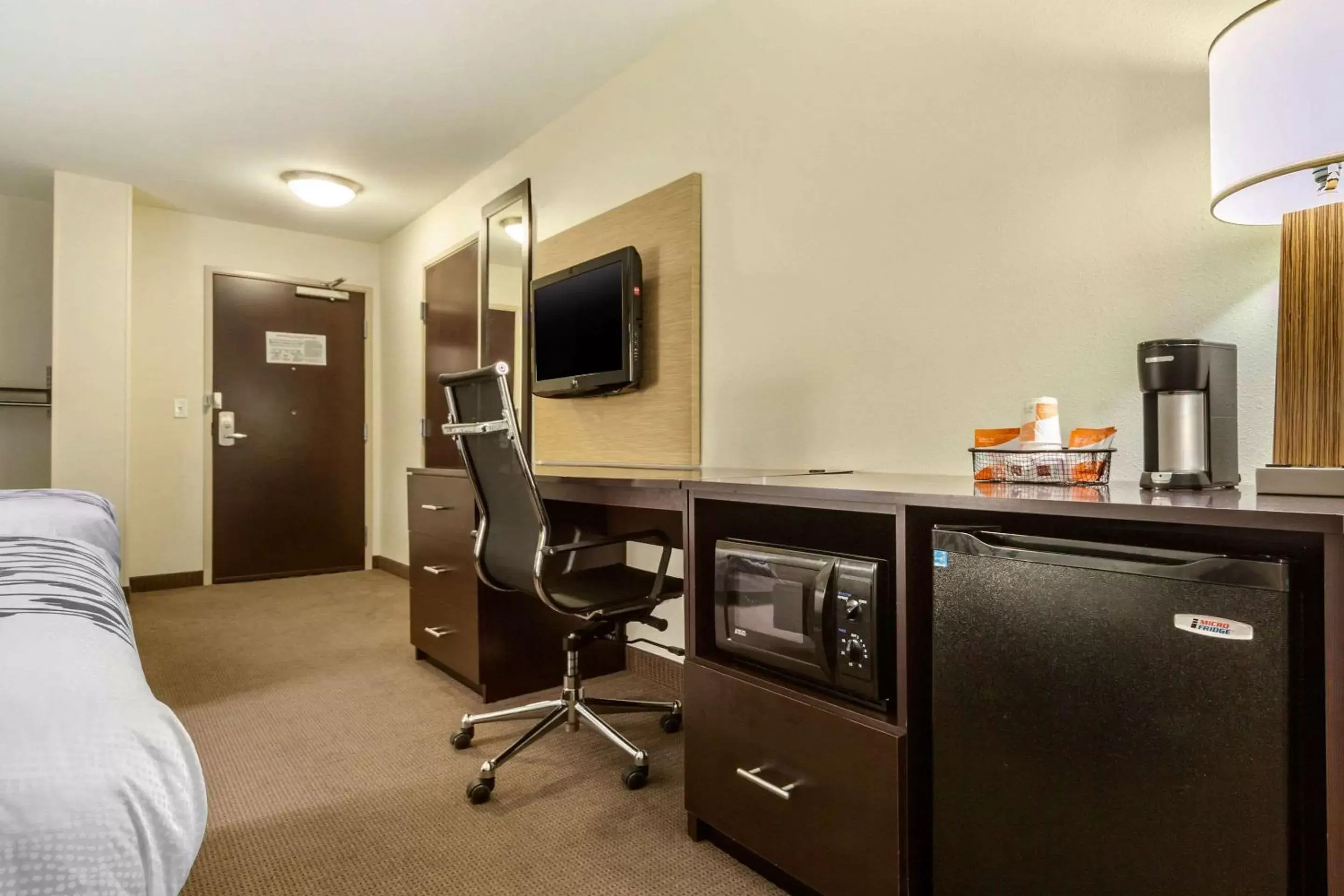 Photo of the whole room, TV/Entertainment Center in Sleep Inn & Suites Grand Forks Alerus Center