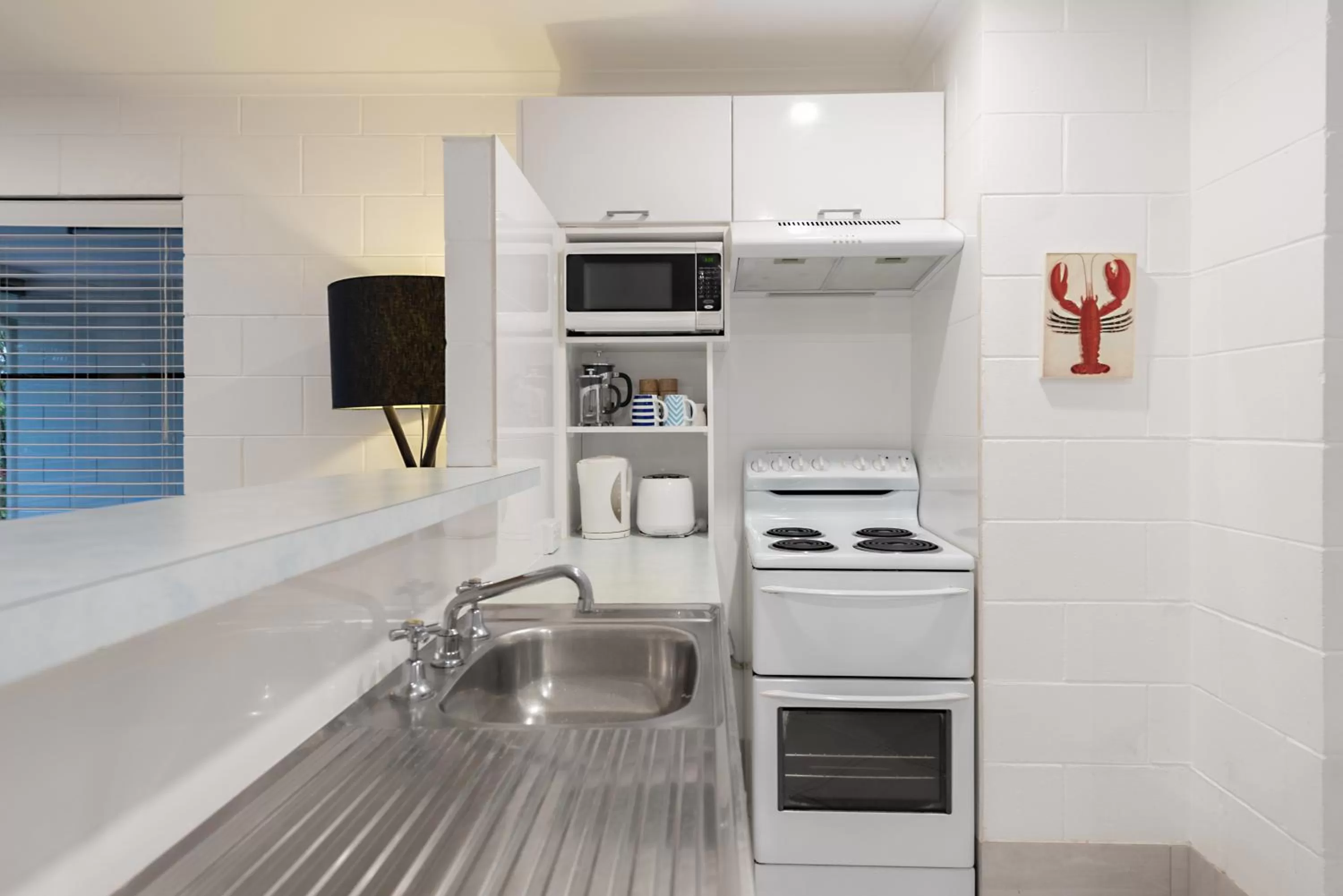 Kitchen or kitchenette in Lychee Tree Holiday Apartments