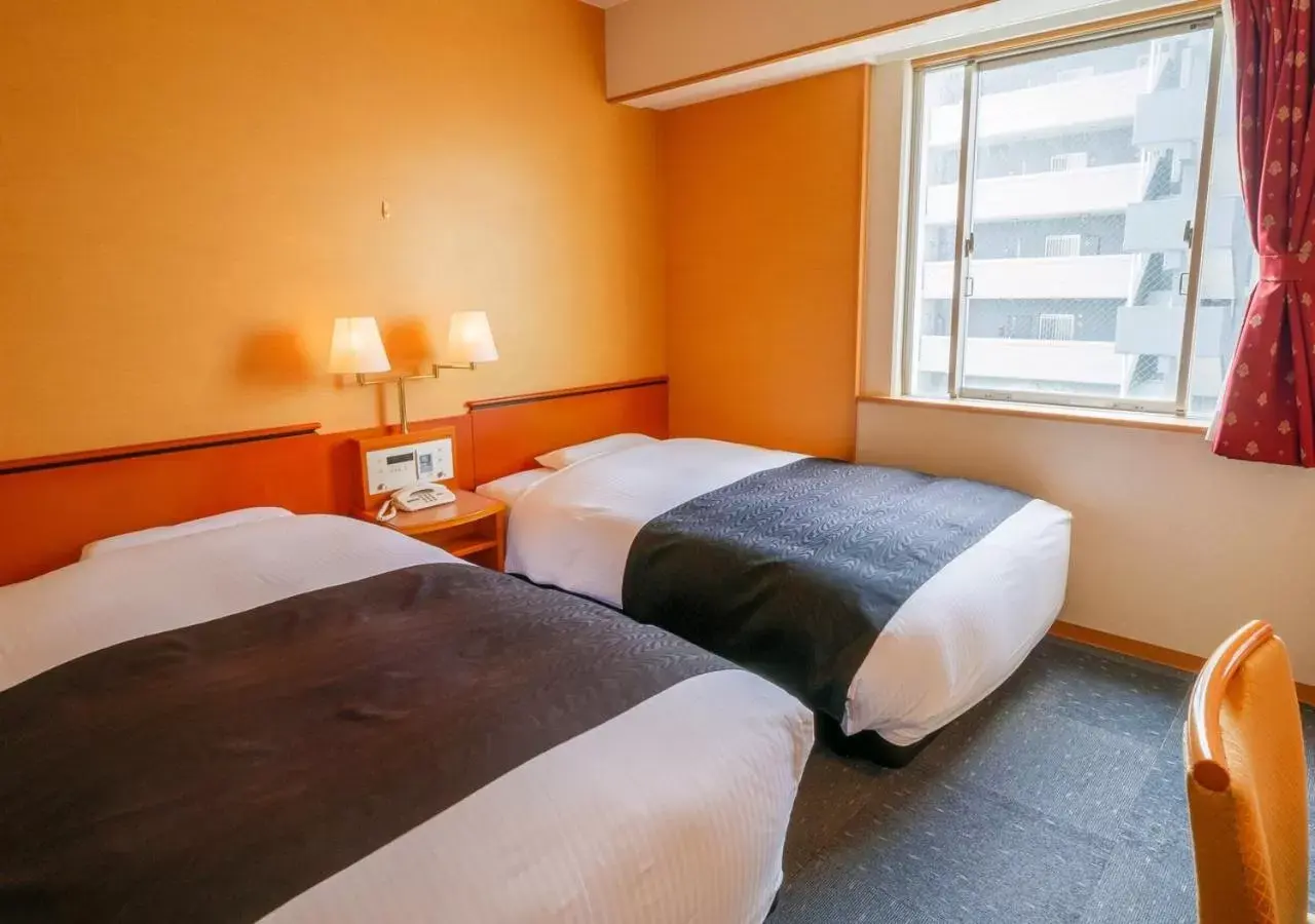 Photo of the whole room, Bed in APA Hotel Miyazaki Nobeoka Ekimae