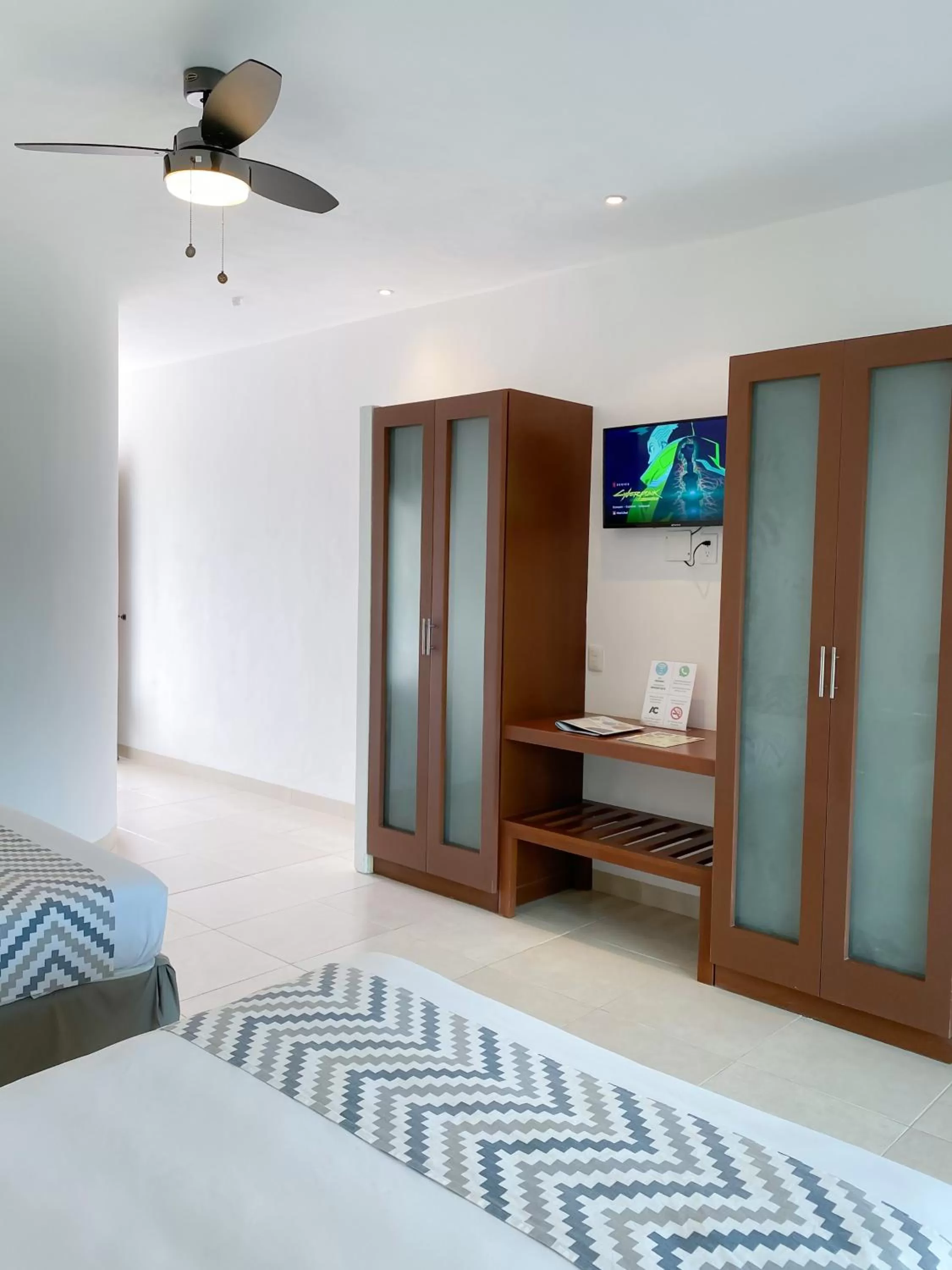 Photo of the whole room, Bed in Maia Suites Cozumel