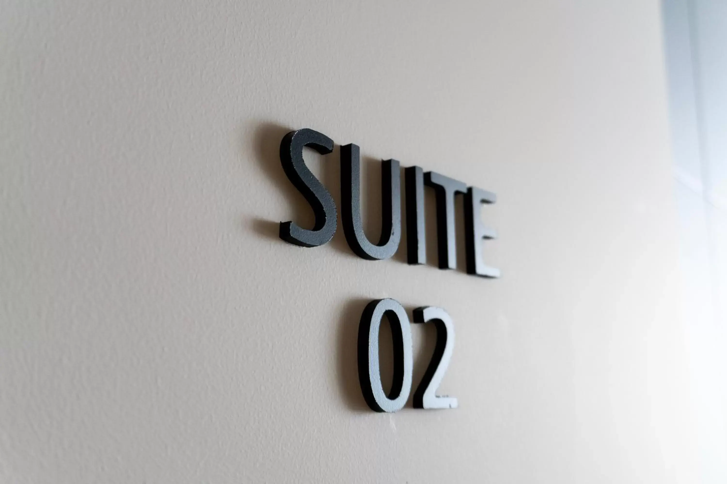 Text overlay in ZOE LUXURY SUITES