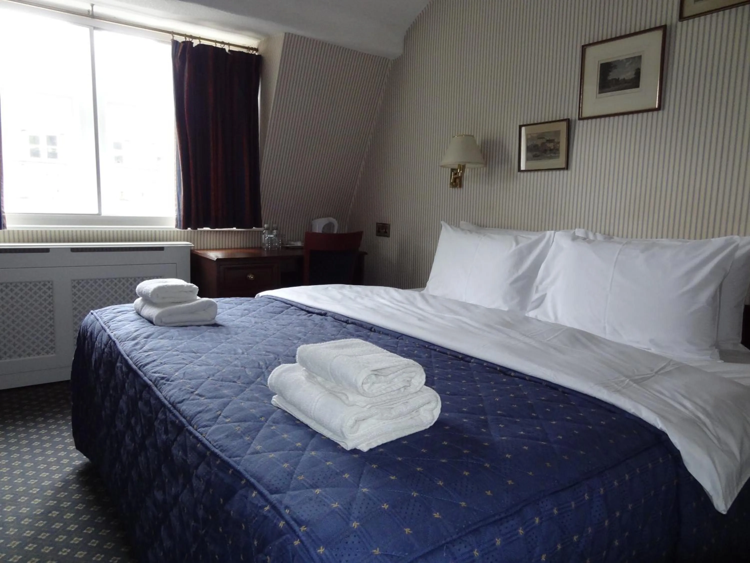 Bed in Regency House Hotel