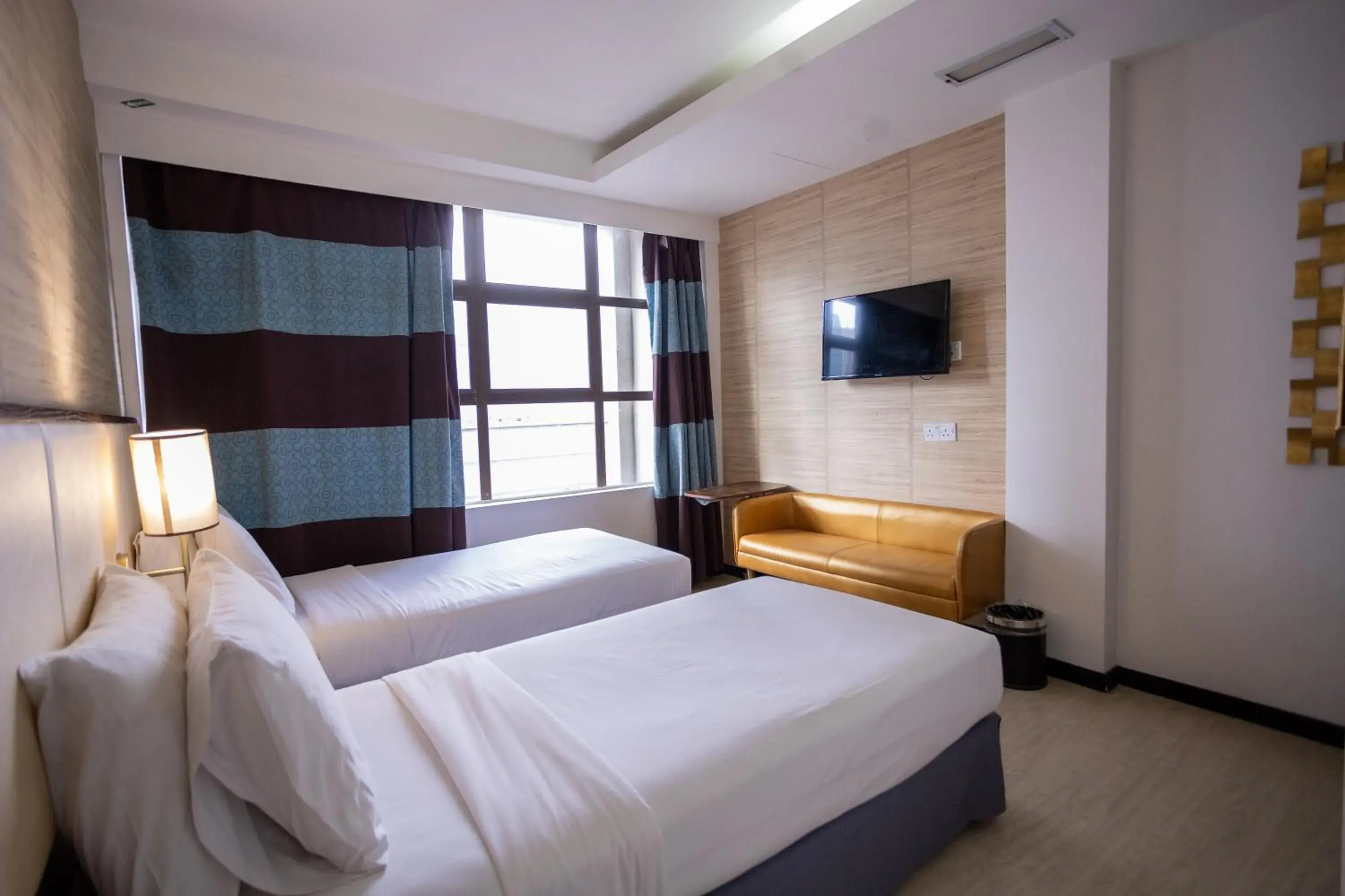 Communal lounge/ TV room, Bed in Citrus Hotel Johor Bahru by Compass Hospitality