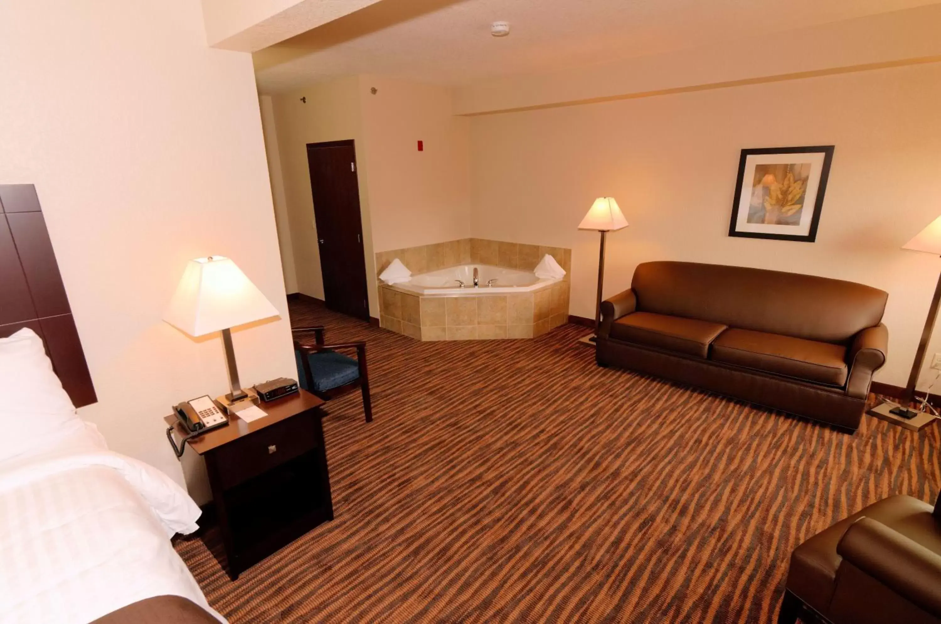 Photo of the whole room, Seating Area in Cobblestone Inn & Suites - Denison | Oak Ridge