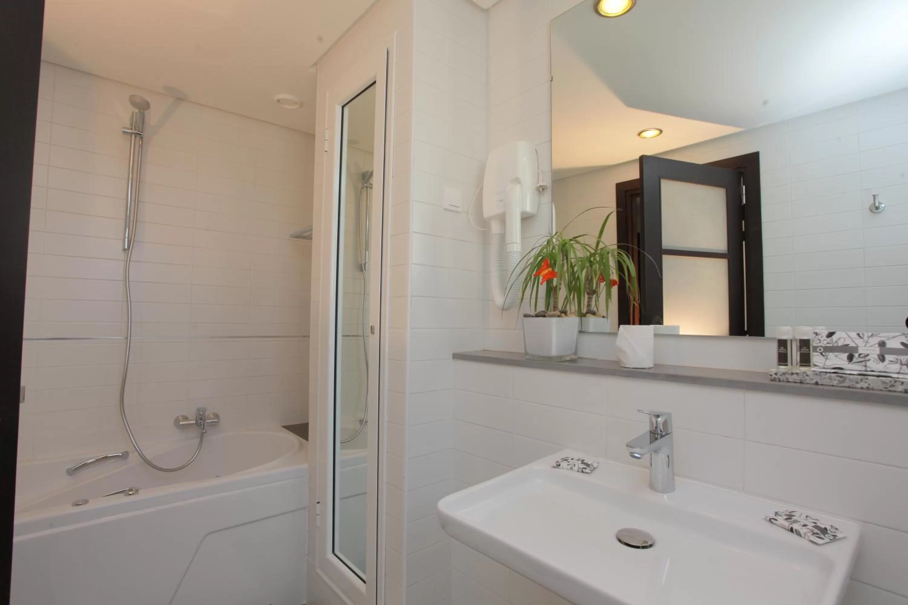 Bathroom in Le Corail Suites Hotel