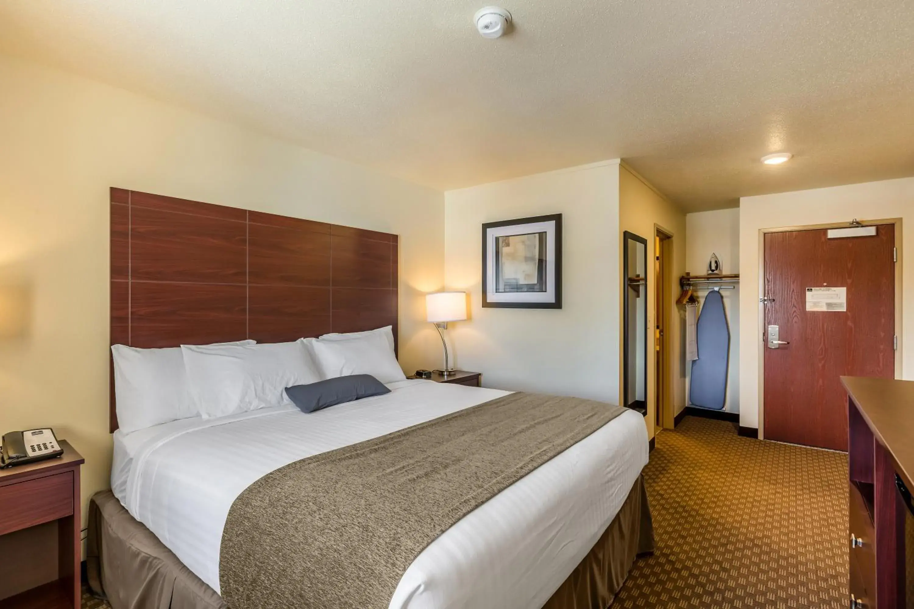 Bed in Cobblestone Inn & Suites - Merrill