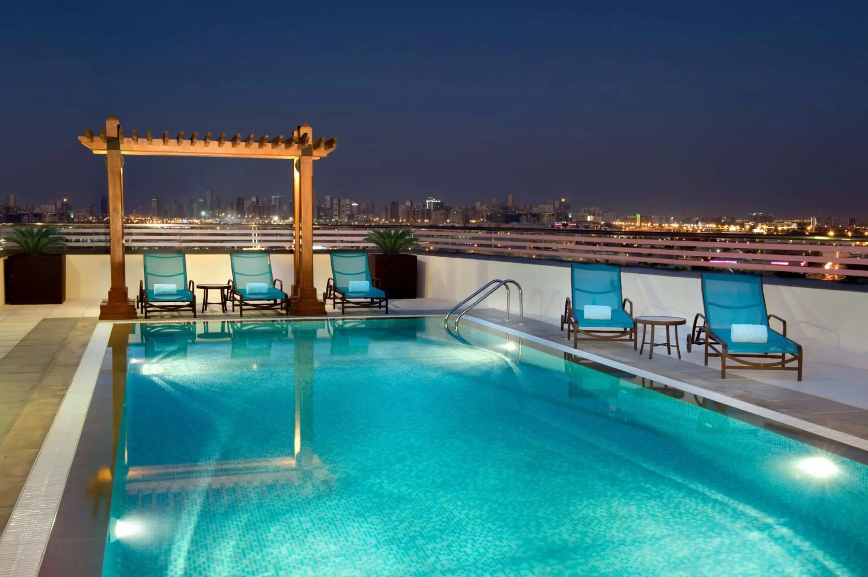Pool view, Swimming Pool in Hilton Garden Inn Dubai Al Muraqabat - Deira
