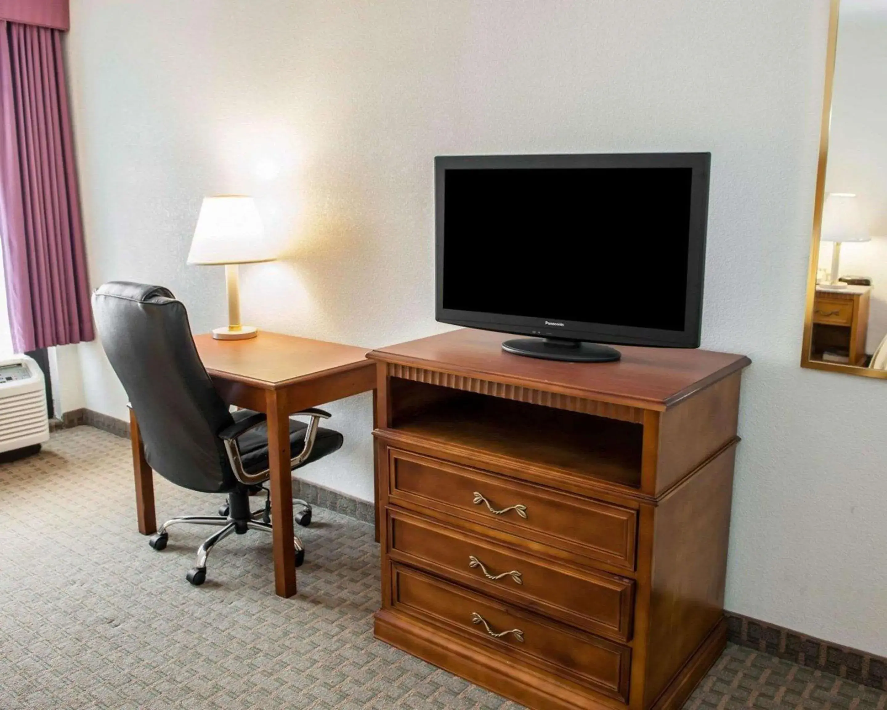 Photo of the whole room, TV/Entertainment Center in Quality Inn and Suites Indianapolis