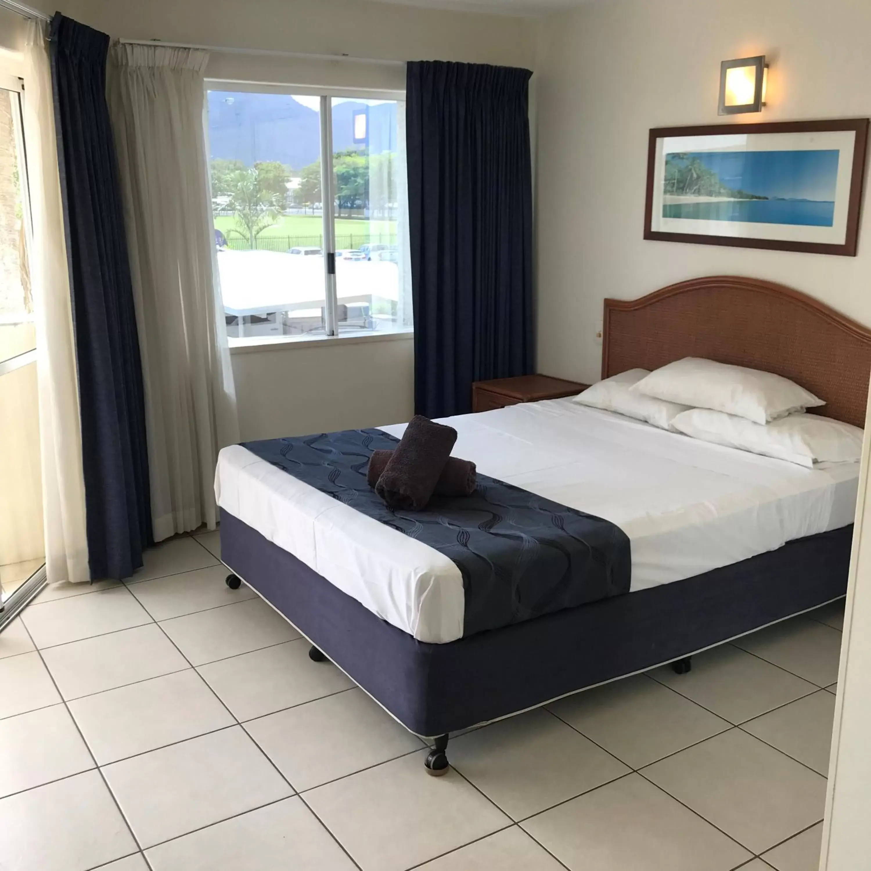 Bed in Reef Gateway Apartments