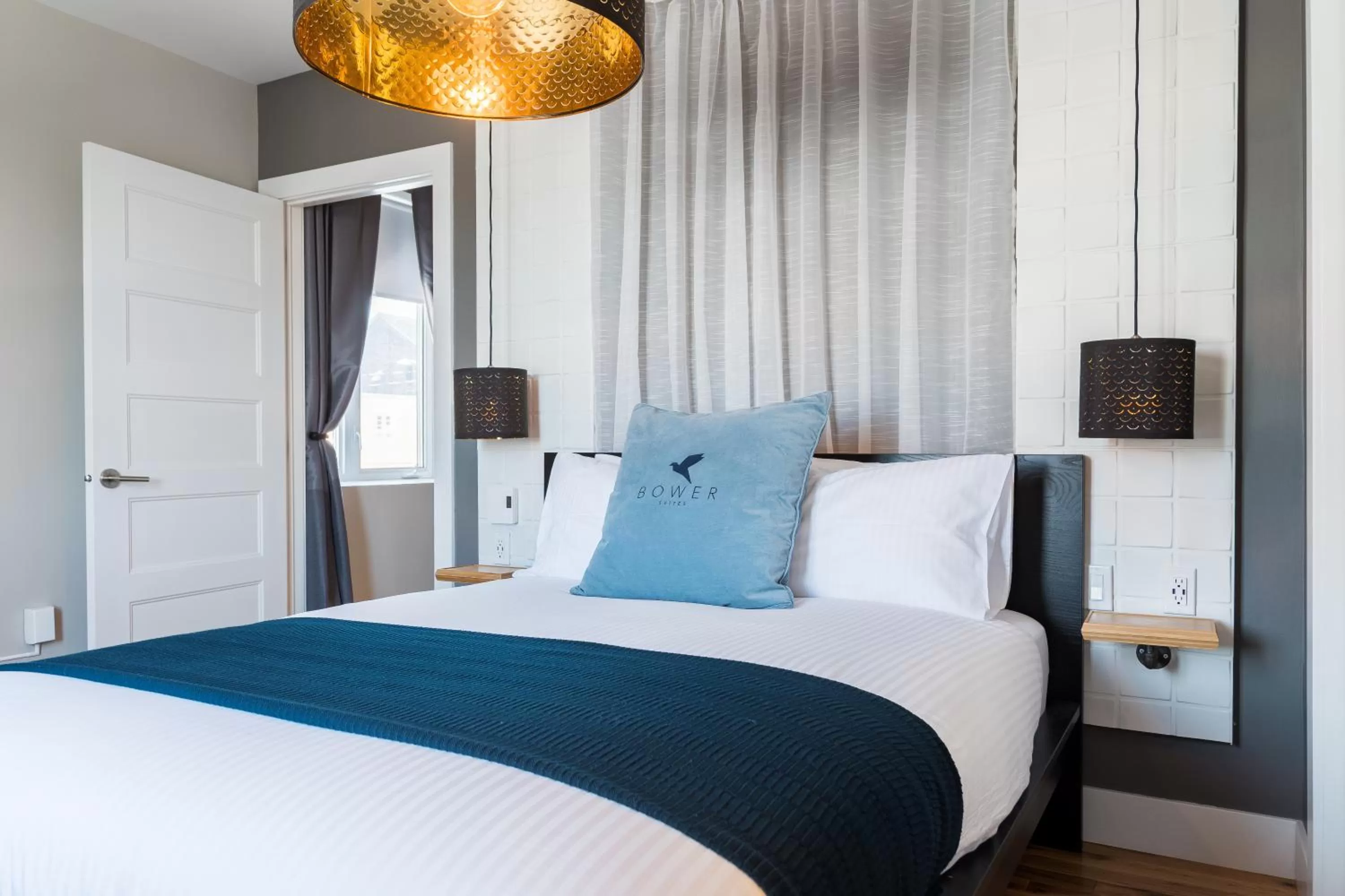 Bed in Capitol Robinson by Bower Hotels & Suites