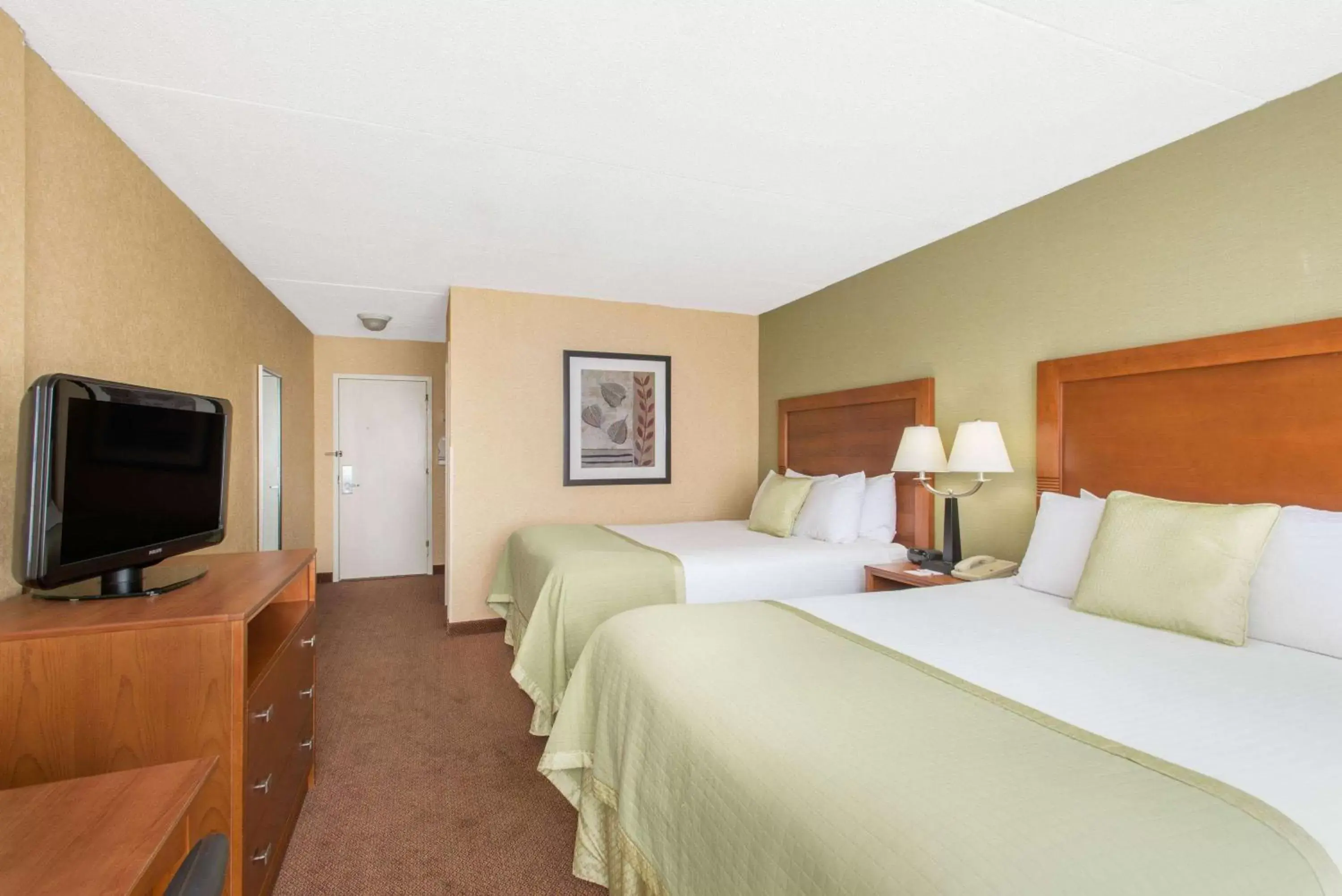 Photo of the whole room, Bed in Ramada by Wyndham Ellsworth - Bar Harbor