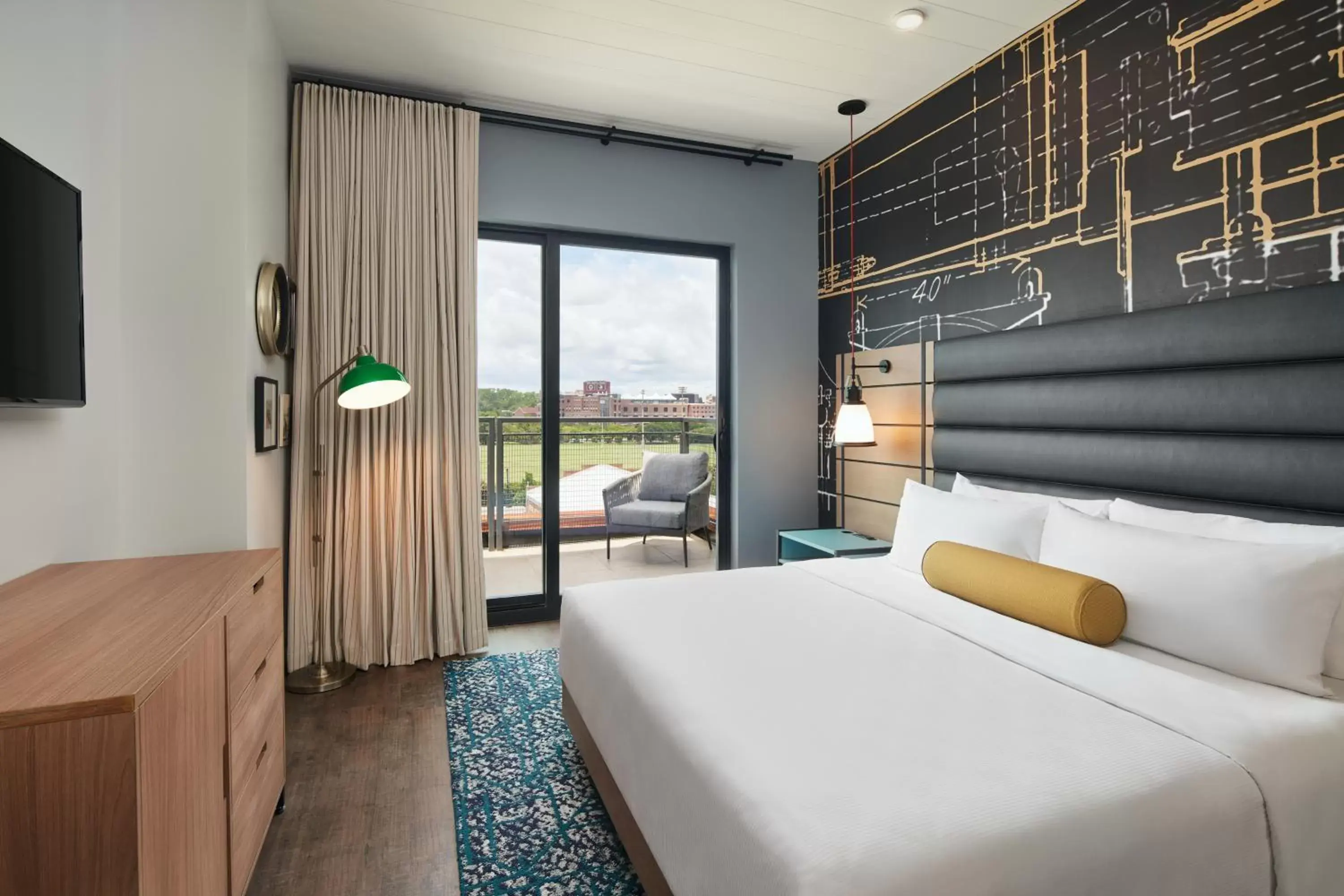 Communal lounge/ TV room, Bed in Hotel Indigo Tallahassee - Collegetown by IHG Communal lounge/ TV room, Bed in Hotel Indigo Tallahassee - Collegetown by IHG